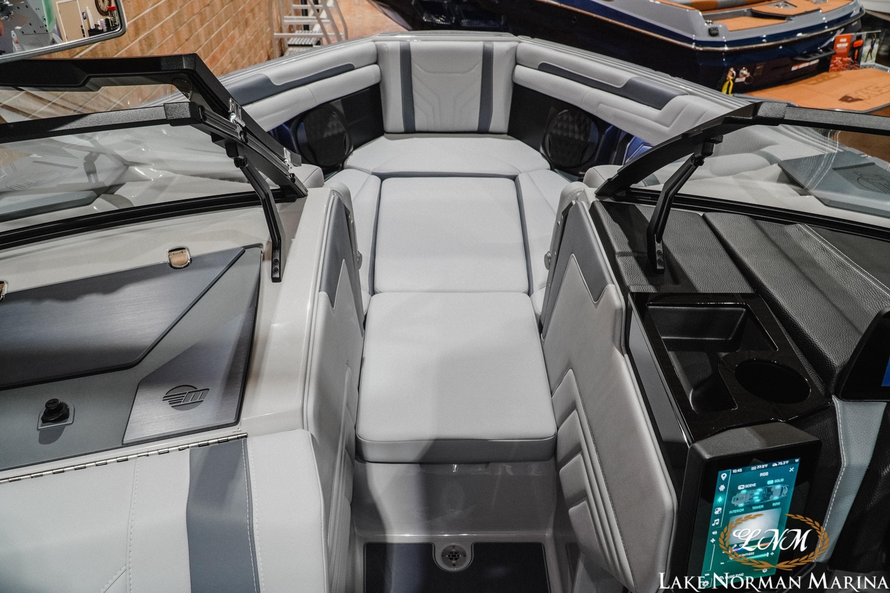Interior of 2026 Malibu Wakesetter 25 LSV boat with sleek seating and modern dashboard.
