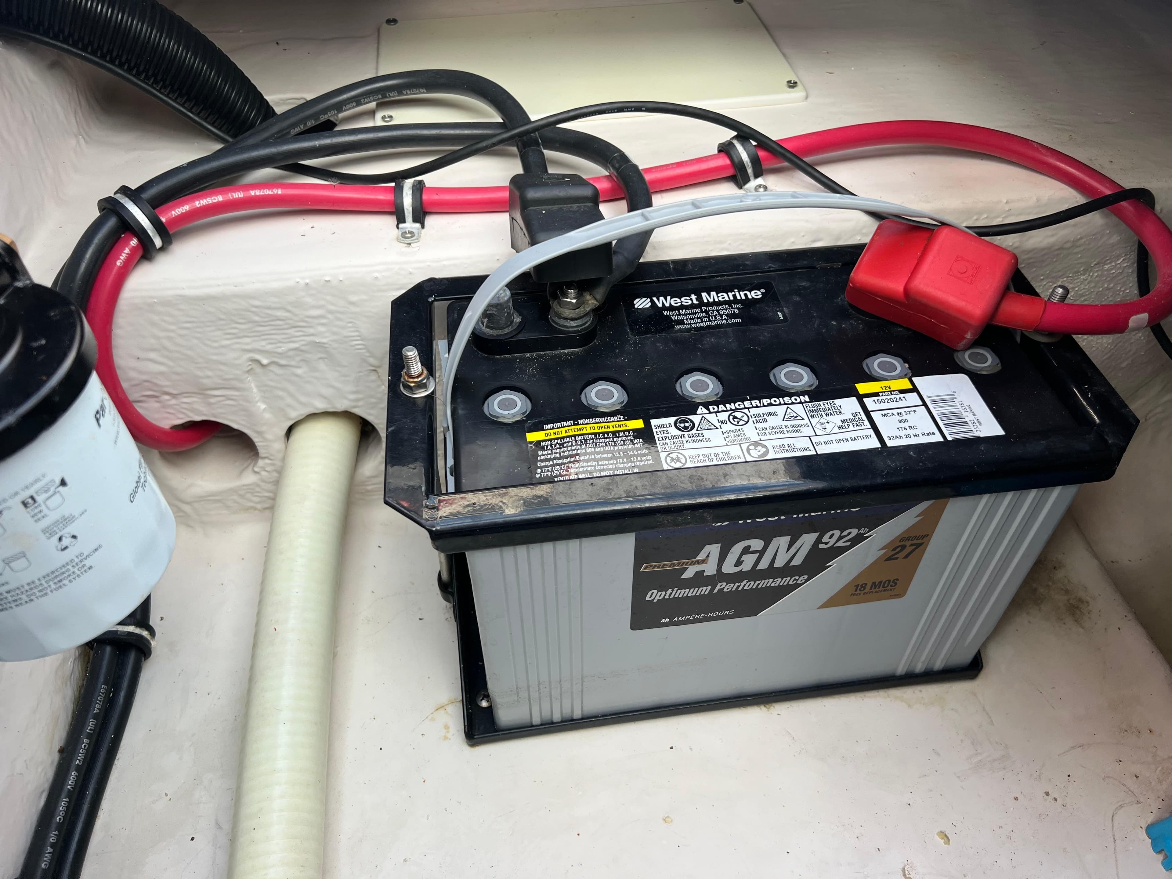 Battery compartment of a 2002 Donzi 29 ZF Cuddy boat with AGM battery.