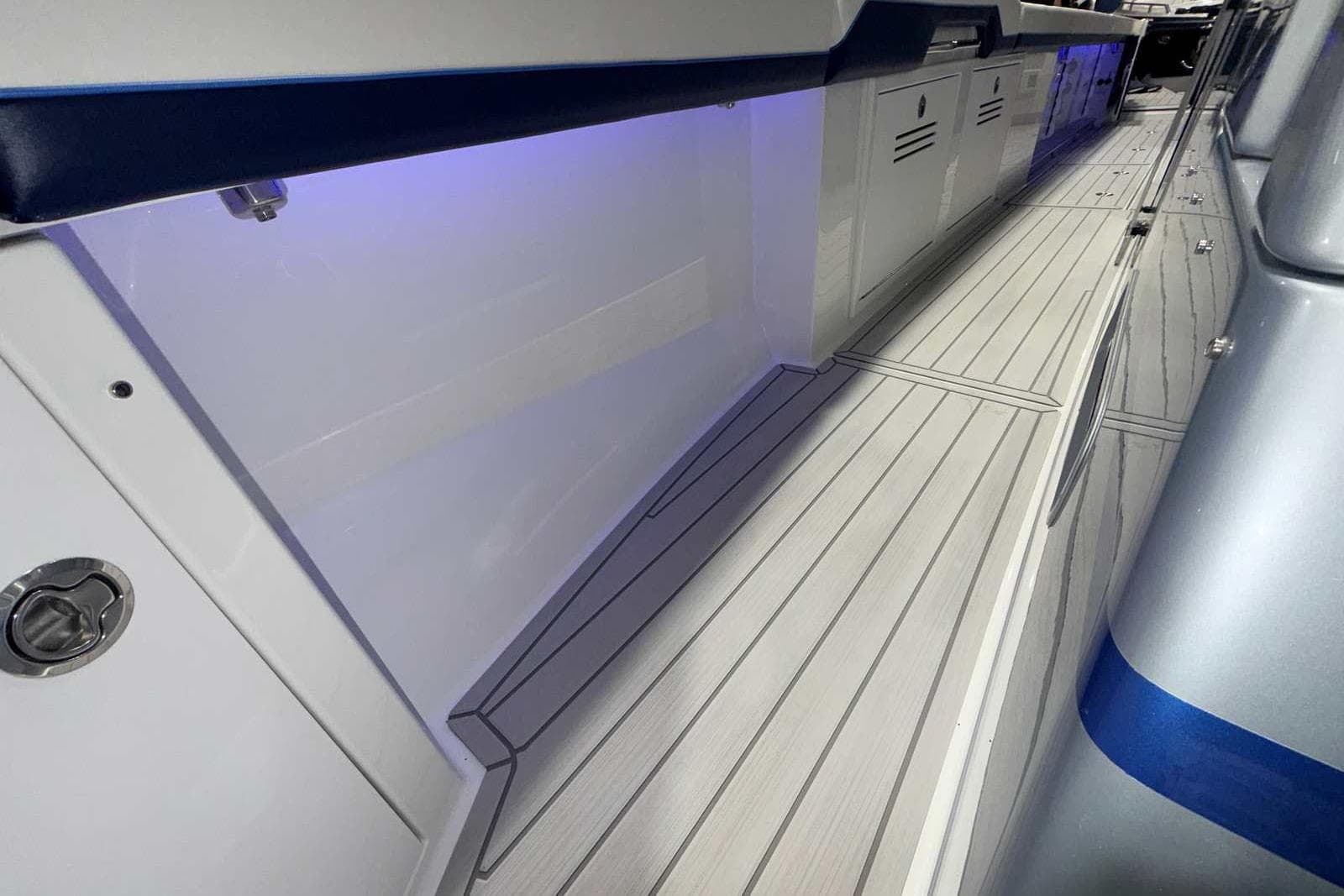 2025 Formula 387 Center Console Fish boat interior with sleek flooring and ambient lighting.