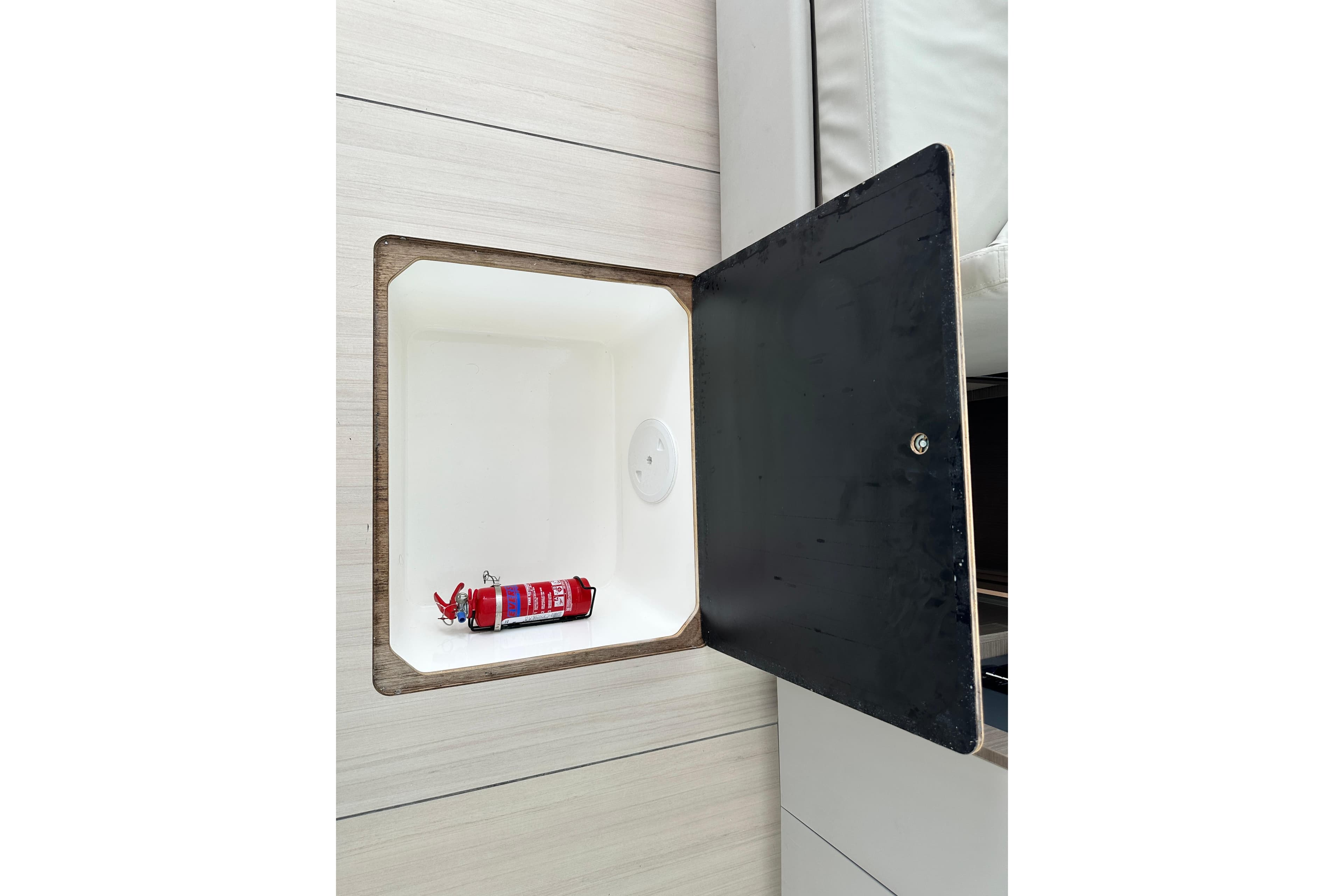 Storage compartment with fire extinguisher on Leopard 46 Powercat, 2025 model by Robertson and Caine.