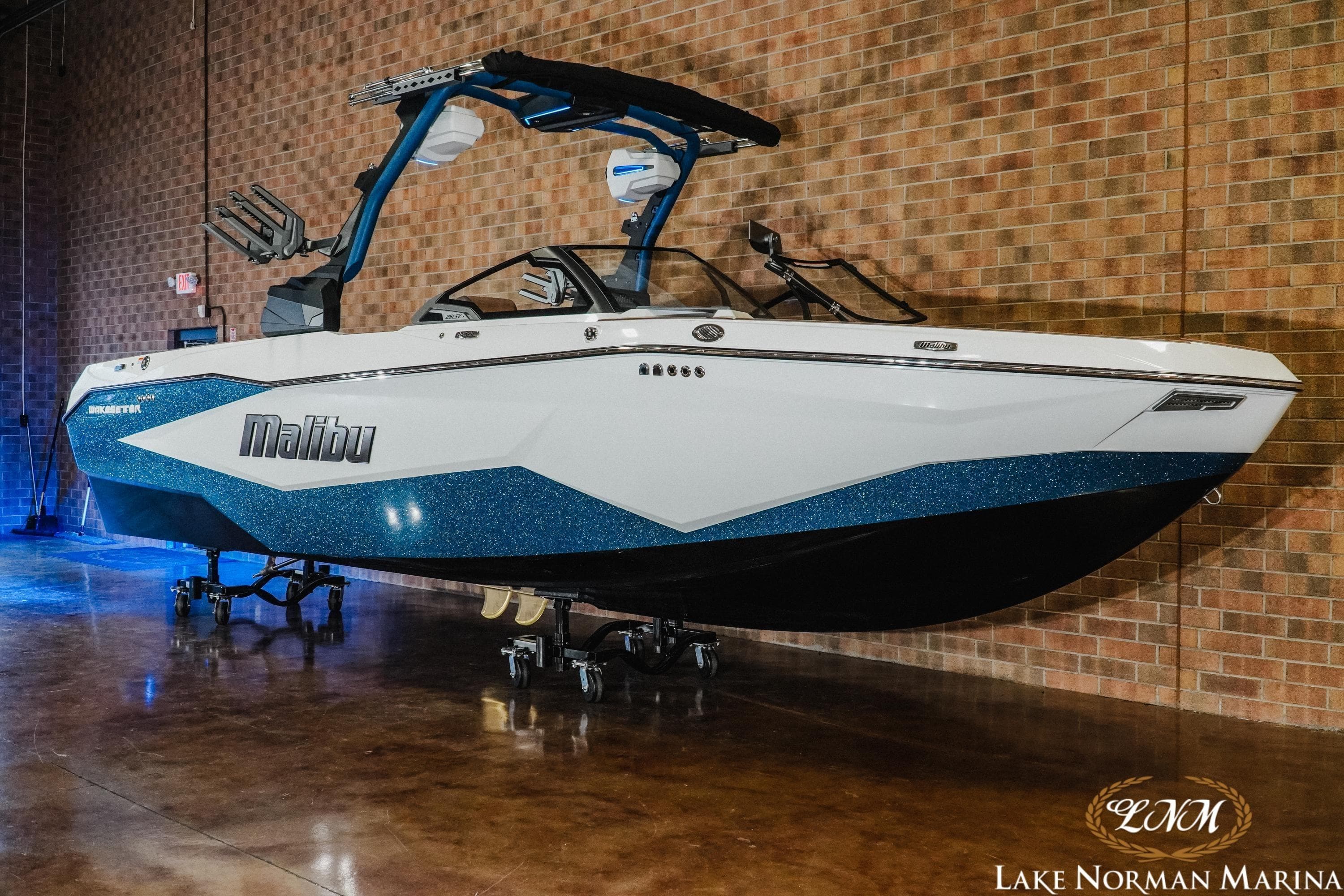 2026 Malibu Wakesetter 25 LSV boat displayed indoors at Lake Norman Marina.
