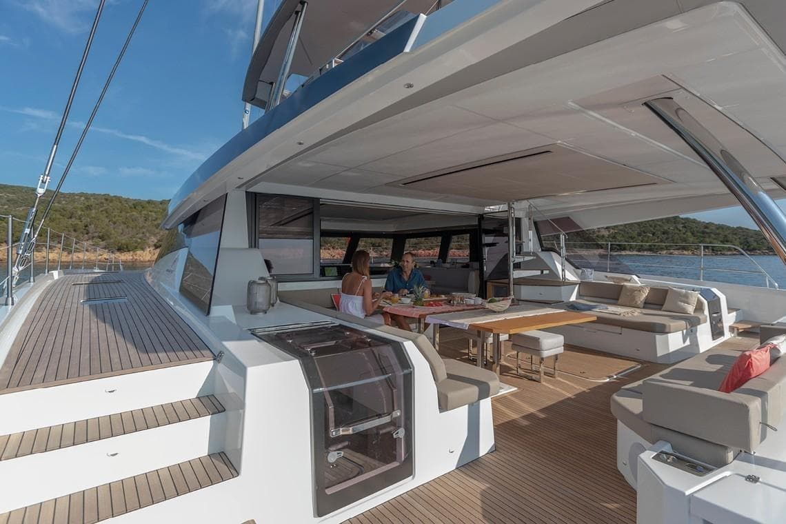 2024 Fountaine Pajot Alegria 67 Catamaran, spacious deck with seating, ocean view.