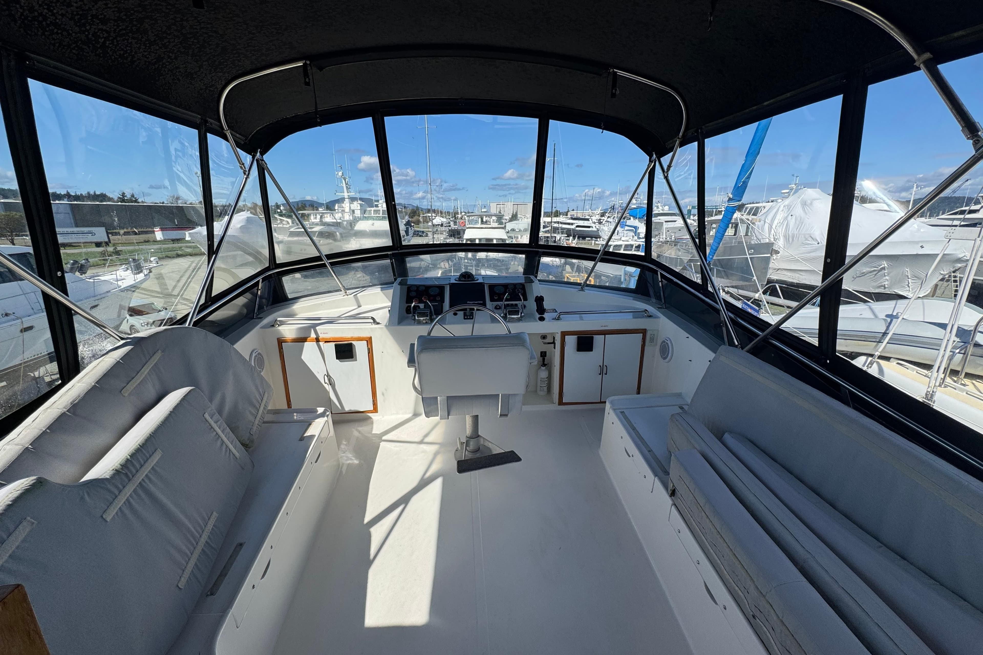 1987 Lien Hwa 47 Cockpit Motoryacht interior with helm and seating area.