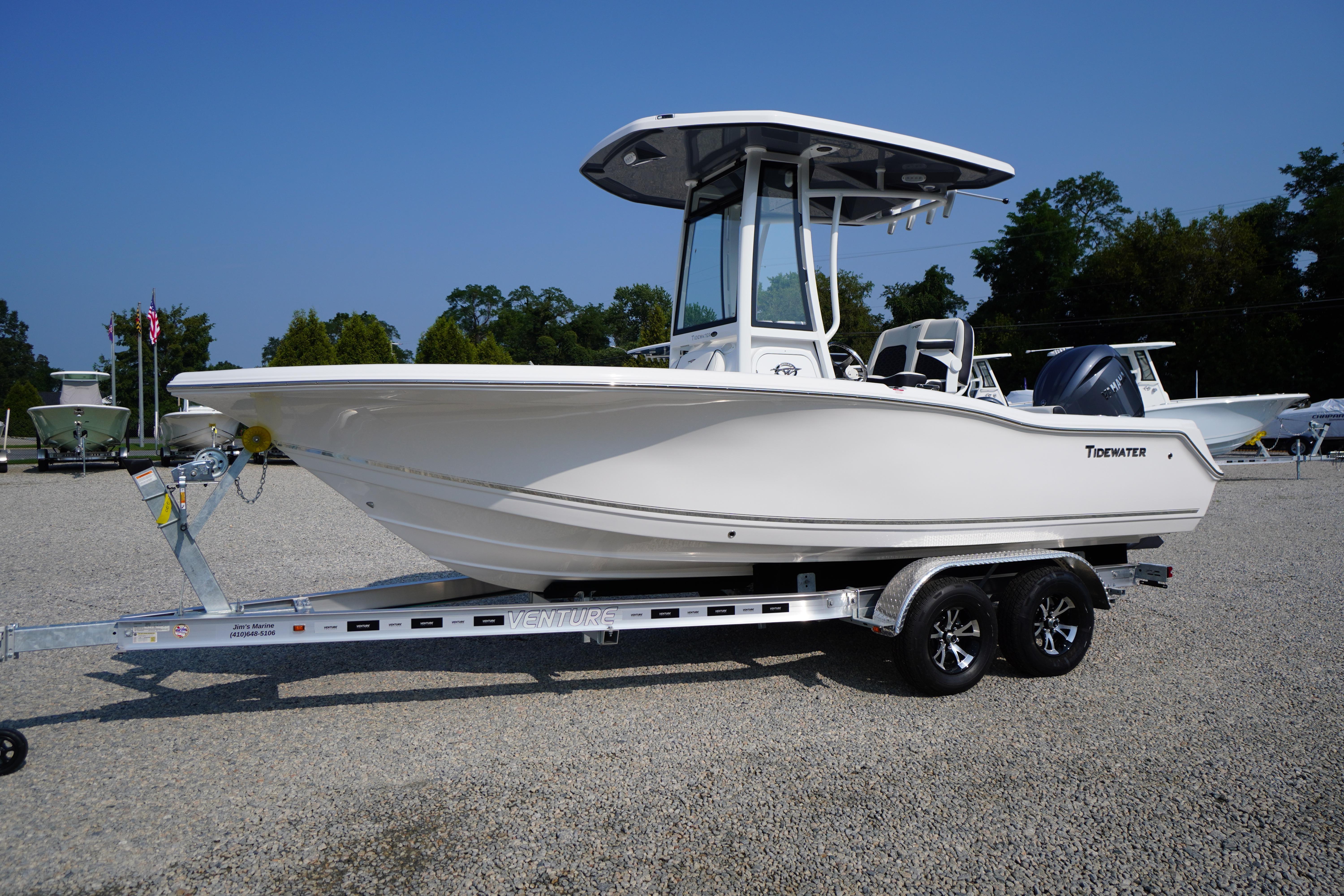 2026 Tidewater 210 CC Adventure boat on trailer, displayed outdoors.