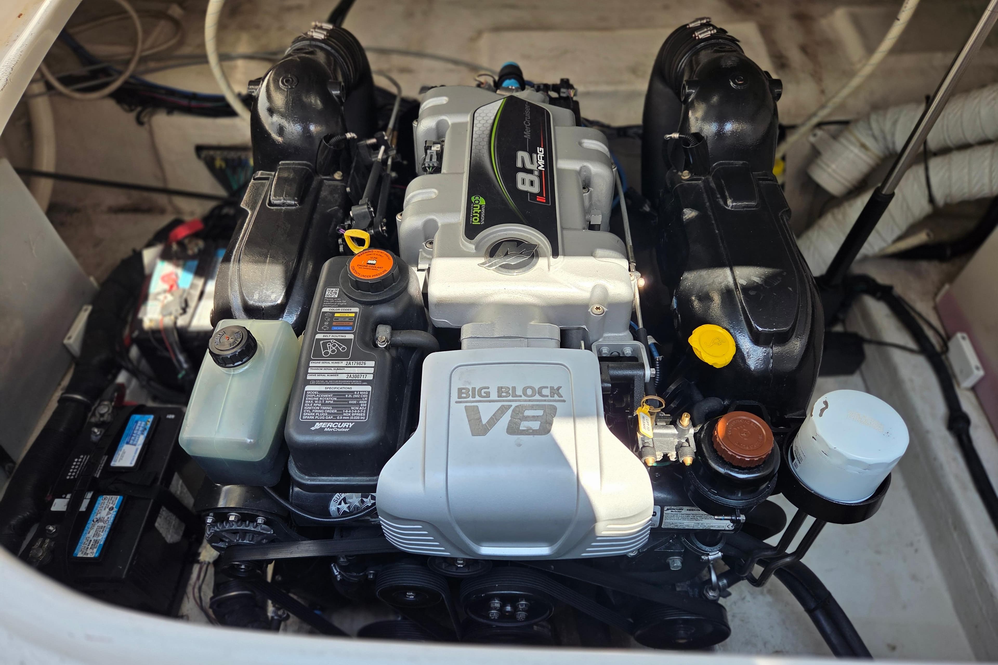 Engine compartment of a 2014 Rinker 290 Express Cruiser with a Big Block V8 engine.