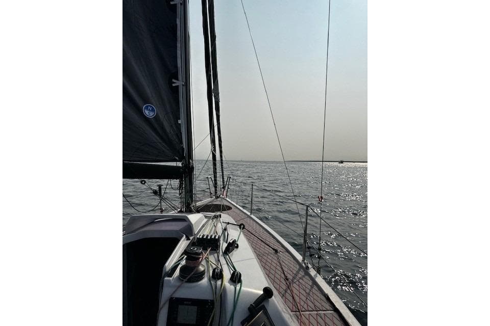 2020 Dehler 30 OD sailboat on calm waters under a clear sky.