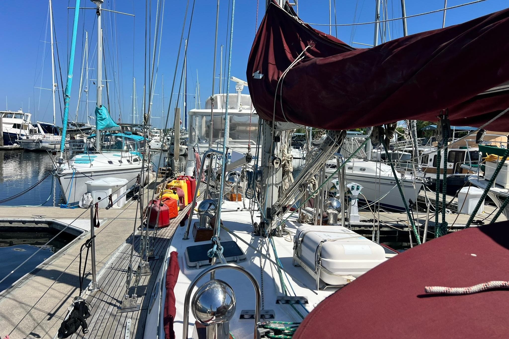 1988 Tayana Vancouver 42 sailboat docked in marina.