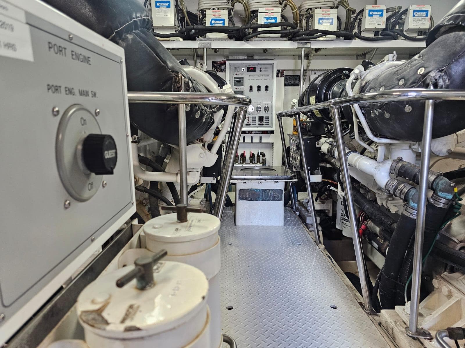 Engine room of 2007 Hargrave 93' yacht, showcasing machinery and control panels.