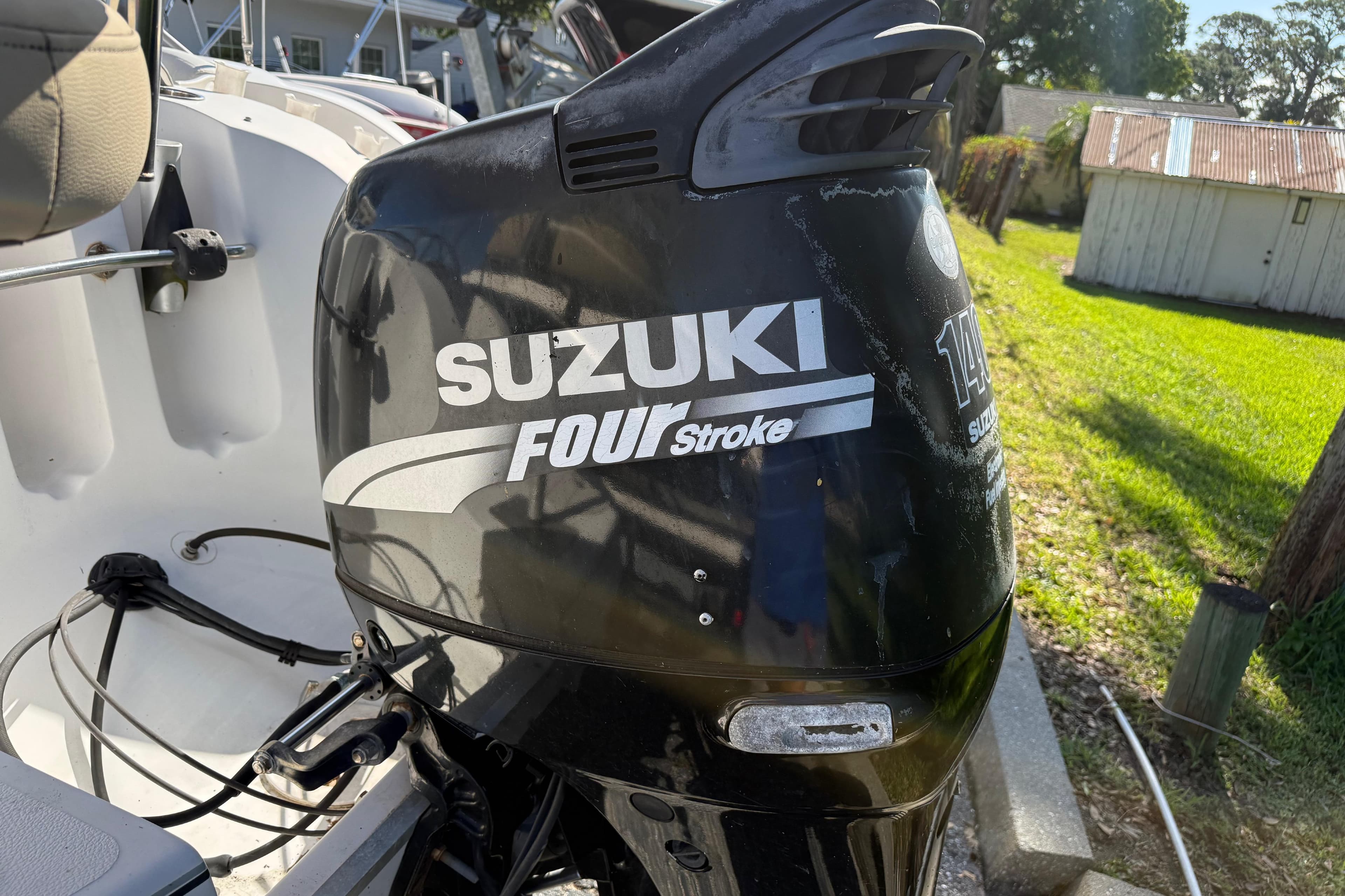 Suzuki Four Stroke outboard motor on a 2005 Starcraft Aurora 2210 OB boat.