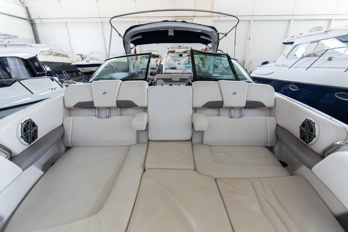 2018 Four Winns 290 Horizon boat interior with spacious seating in a showroom.