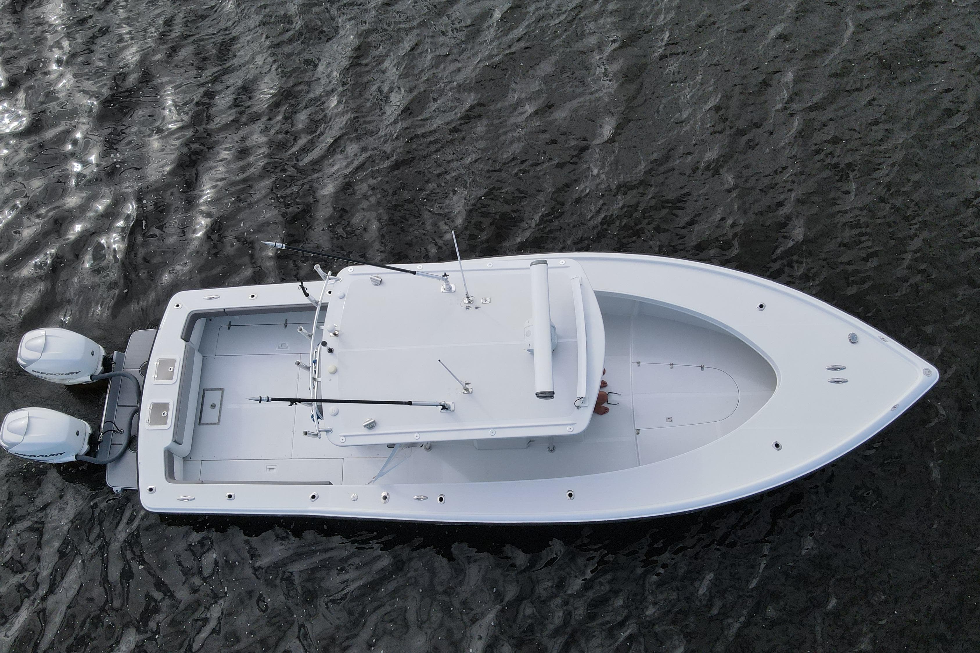 1984 Rybovich Rybo Runner boat with dual engines on open water.