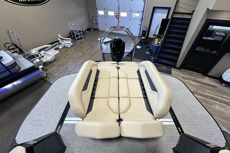 2026 Flamingo Rove 24' boat interior with beige seating in showroom.