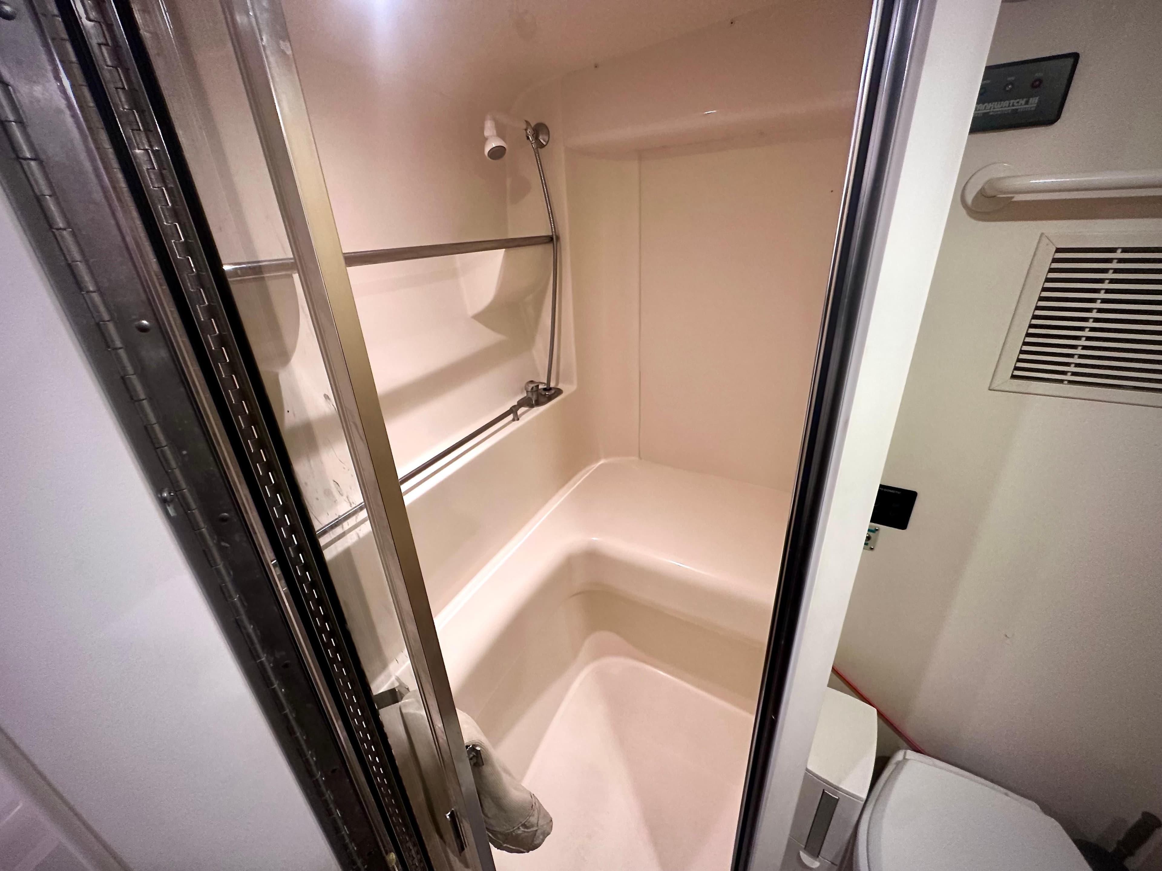 Bathroom interior of 1997 Carver 350 Mariner yacht, featuring shower and toilet.