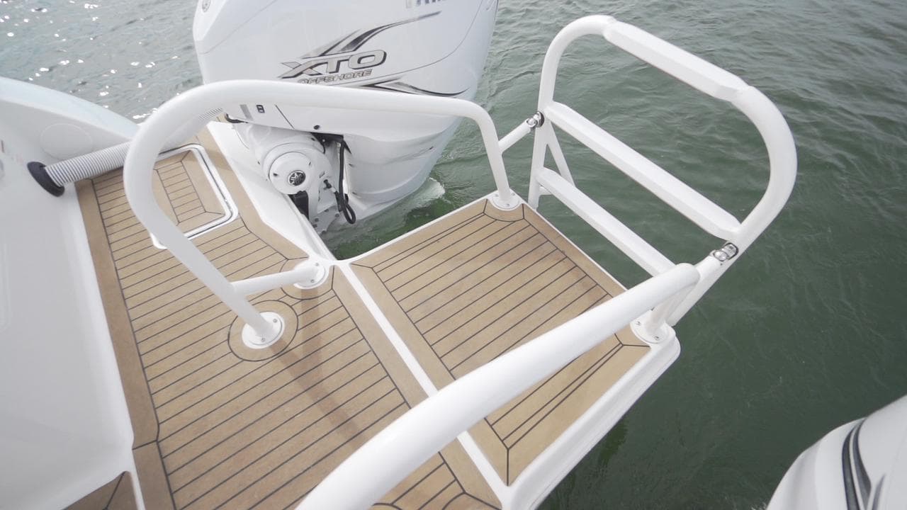 Swim platform on 2026 World Cat 400CC-X boat with outboard motor.