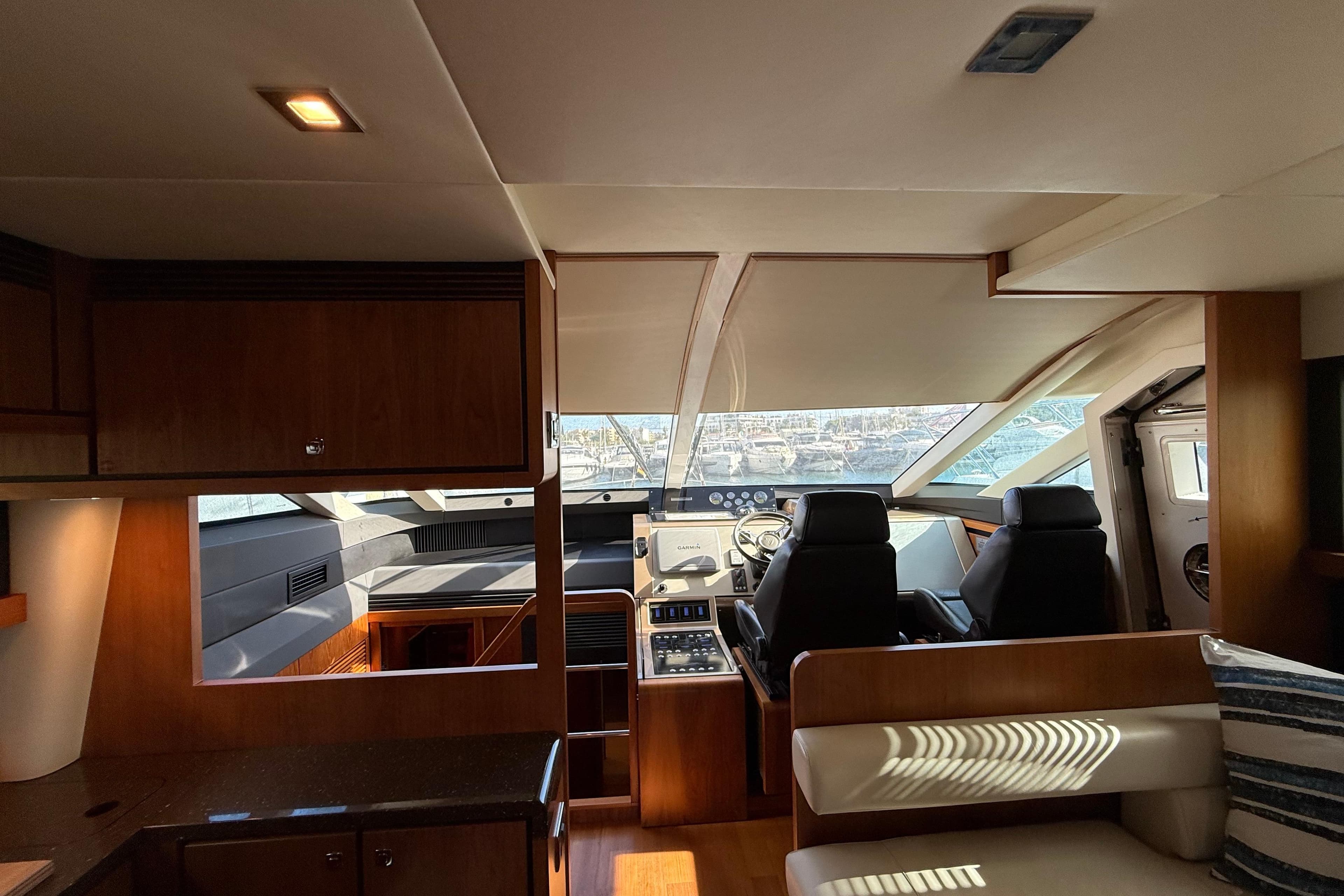 Interior of 2012 Fairline Squadron 58 yacht with modern helm and seating area.