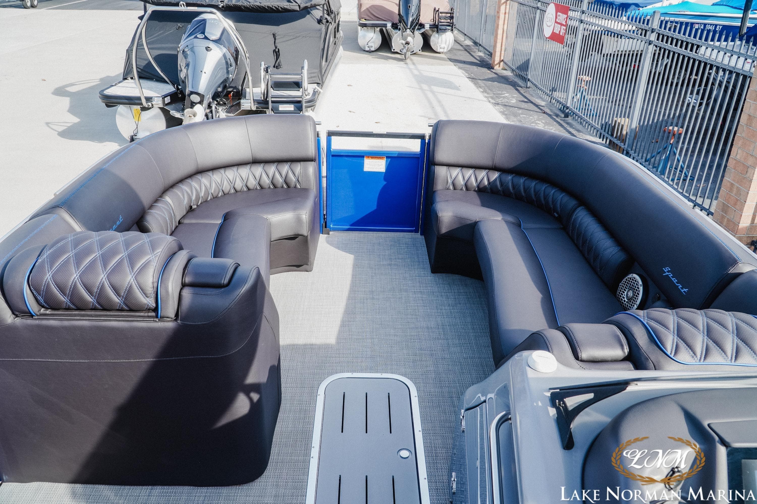 Luxurious seating on a 2025 Bennington 25QXSBA pontoon boat at Lake Norman Marina.