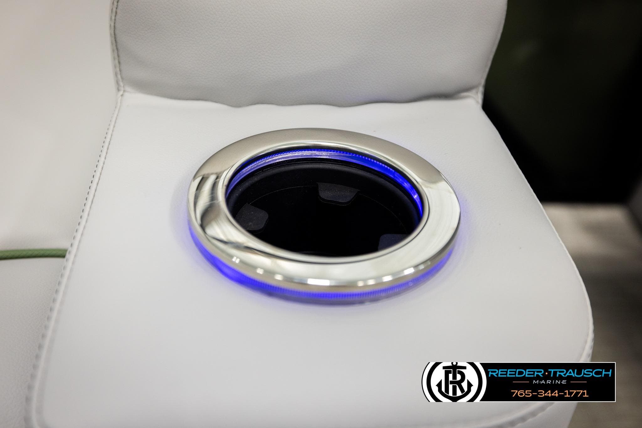 Illuminated cup holder on 2026 Avalon LSZ QLS boat seat, featuring sleek design.