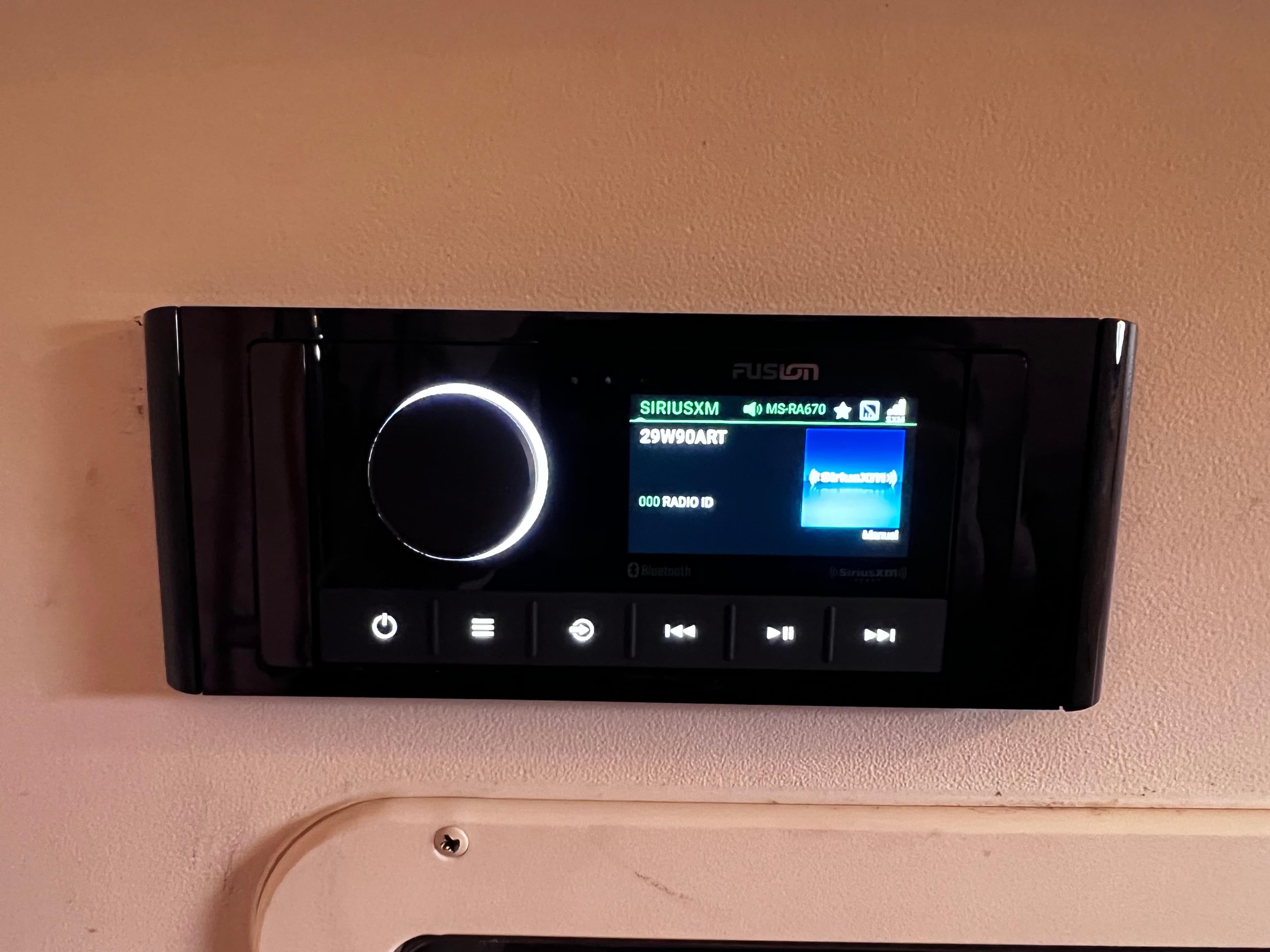 Fusion marine stereo system on 2015 Grady-White 336 Canyon boat dashboard.