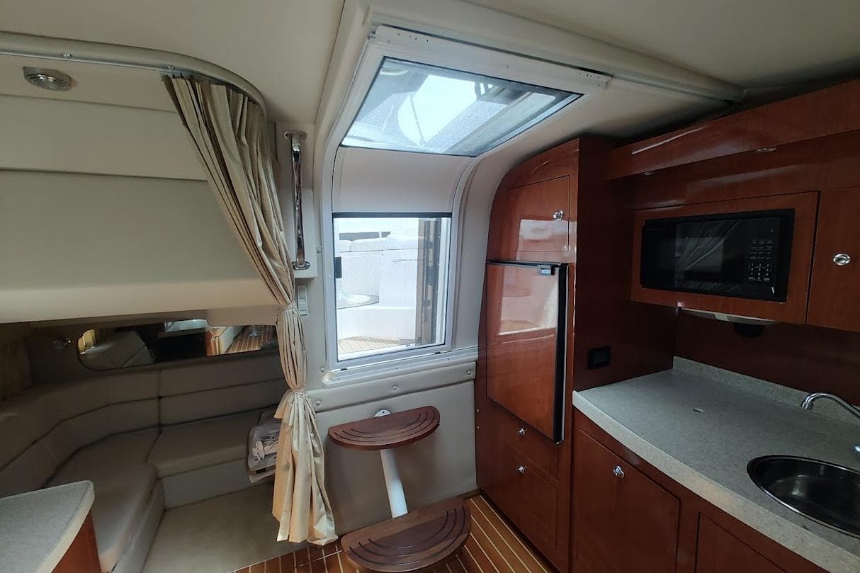 Interior of 2006 Regal Commodore 3560 IO yacht with kitchenette and seating area.