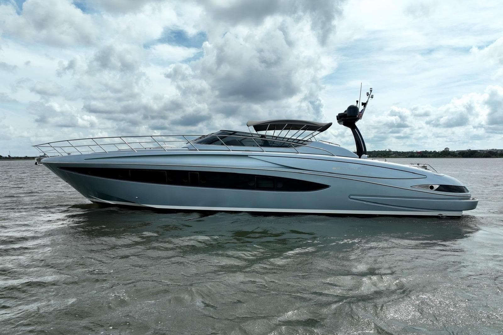 2016 Riva 63 Virtus yacht on open water under cloudy sky.