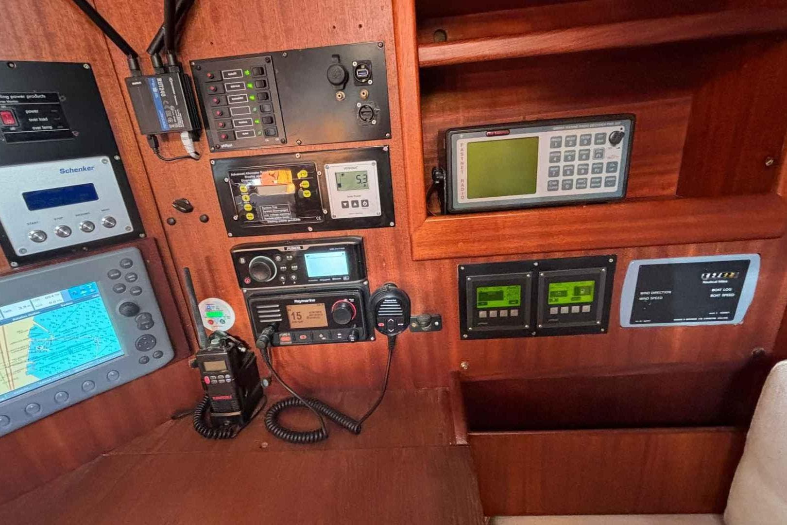 Control panel of a 1978 Vindo 90 sailboat with navigation and communication equipment.