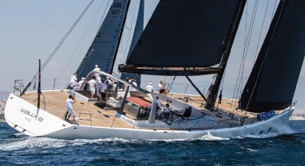Sailing yacht Pendennis Wally 106, 1998 model, cruising on open water with crew onboard.