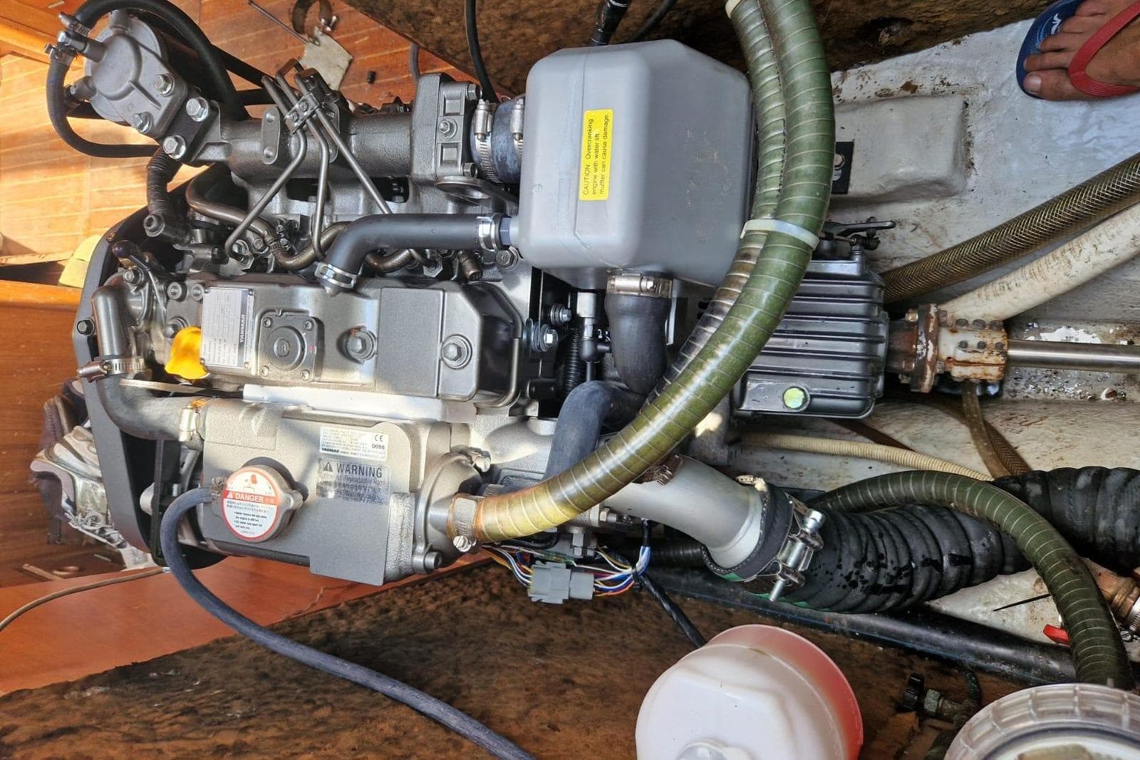 Engine compartment of a 1978 Najad 34 sailboat, showcasing detailed mechanical components.