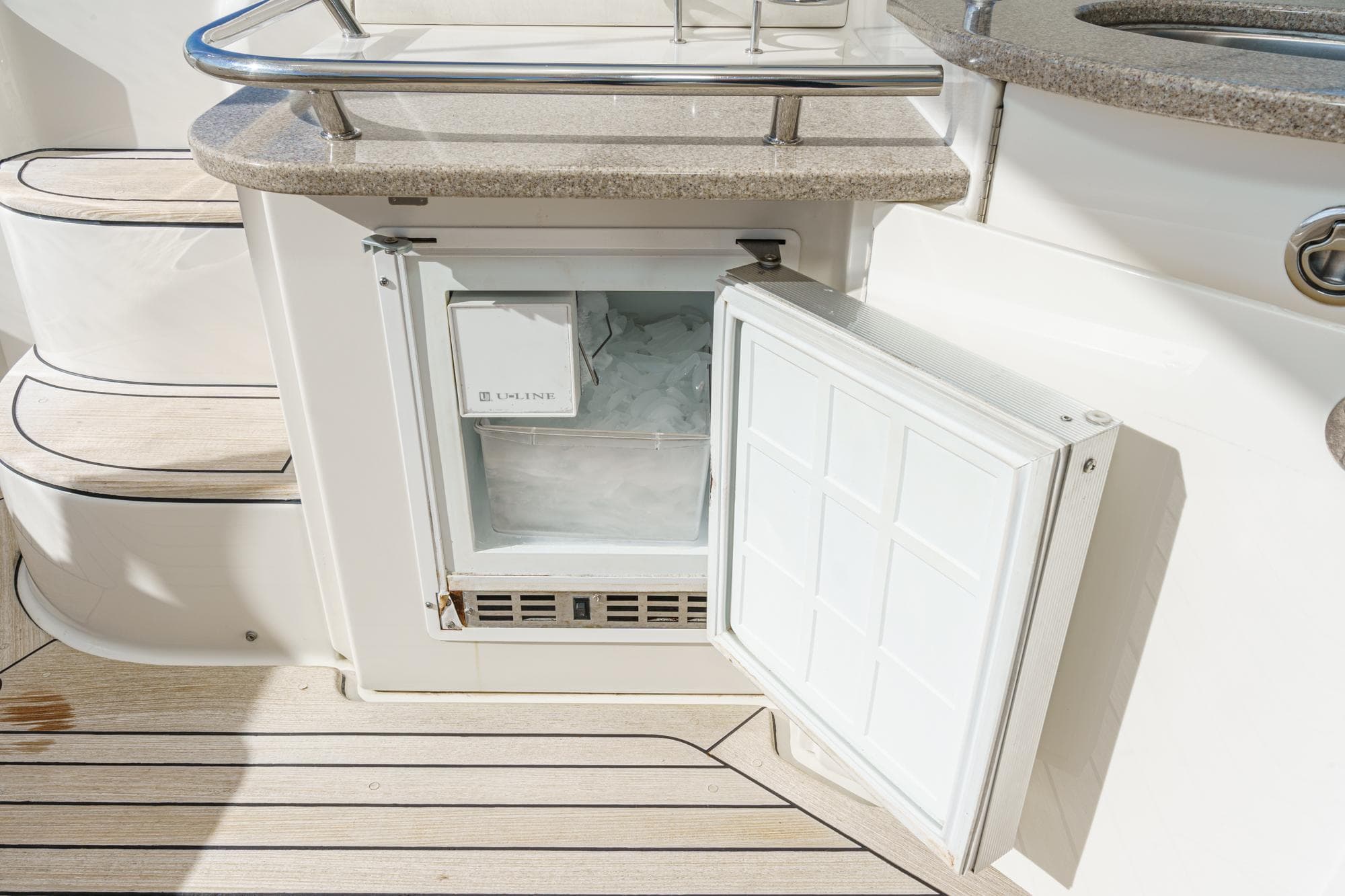 Open refrigerator on a 2005 Sea Ray 480 Sundancer yacht.