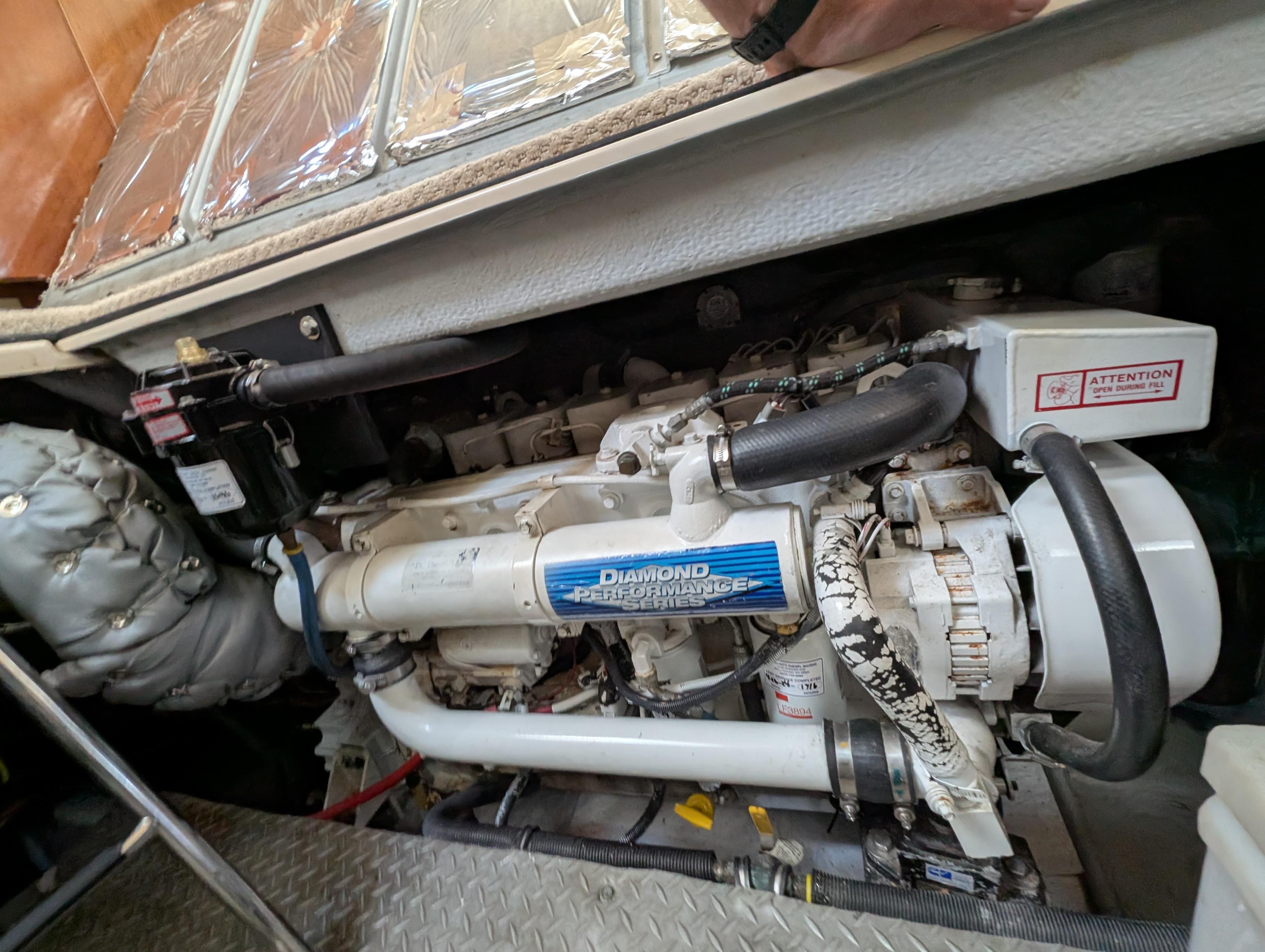 Engine compartment of a 2006 Meridian 368 yacht, featuring a Diamond Performance Series engine.