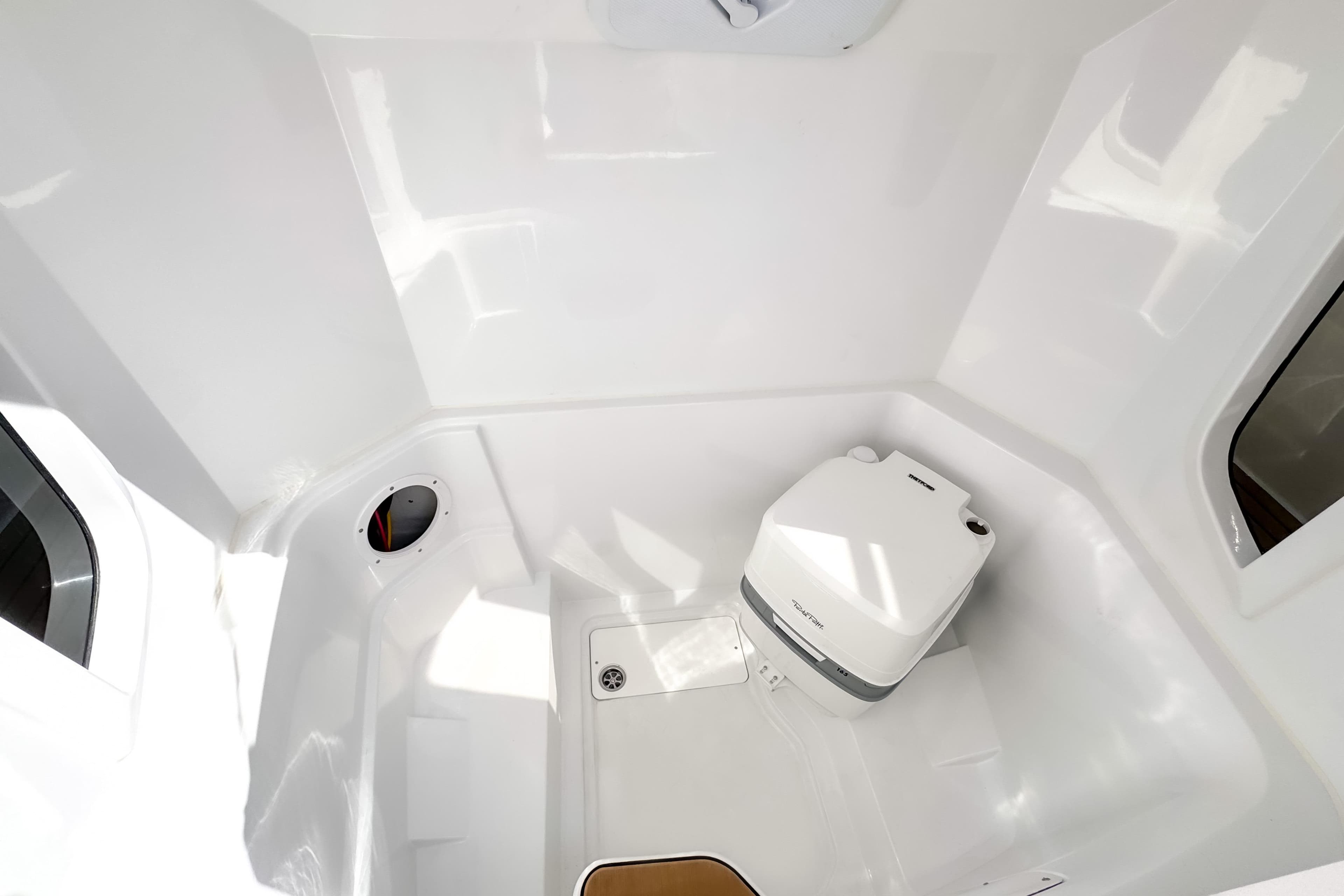 Compact bathroom in 2025 STERK 31 boat with modern white fixtures.