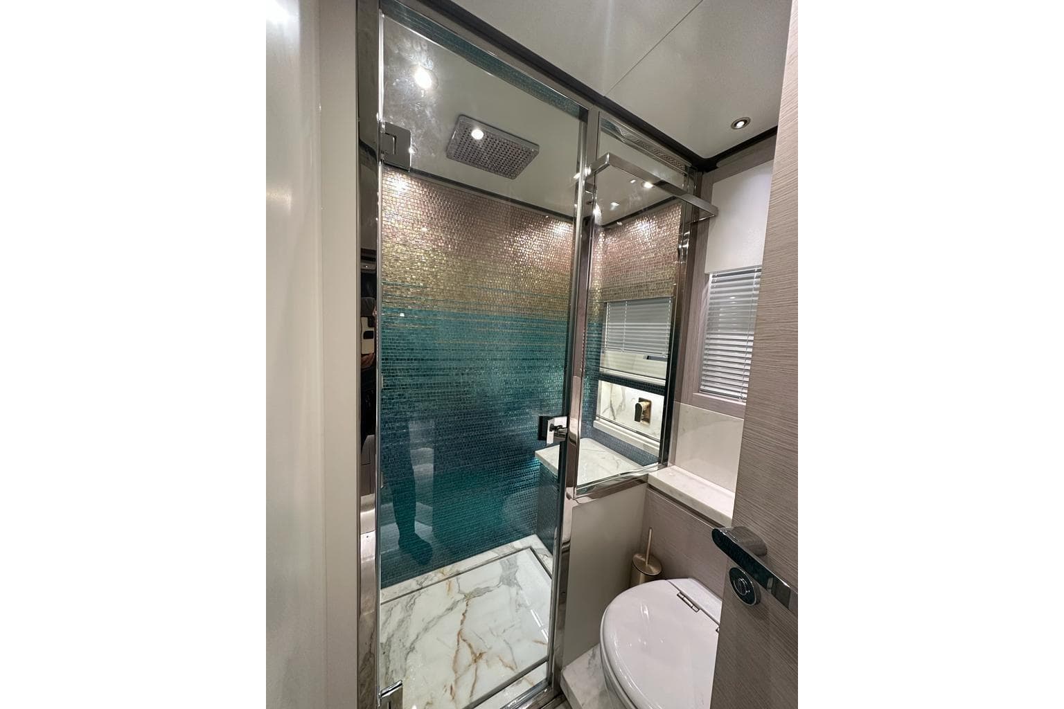 Luxurious bathroom in 2024 Uniesse Exuma HTC5p yacht with glass shower and elegant design.