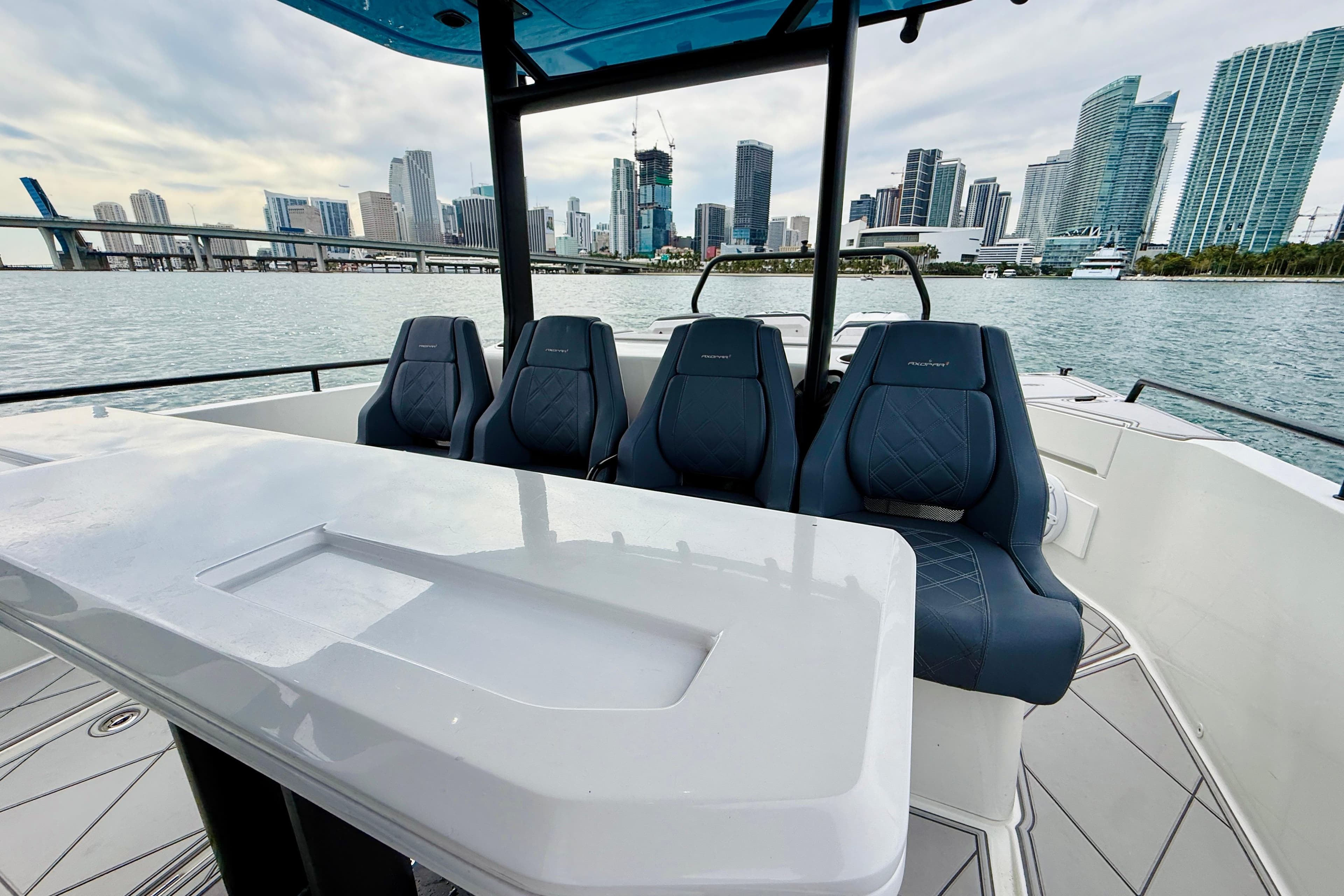 2021 Axopar 37 Sun Top boat interior with city skyline in background.