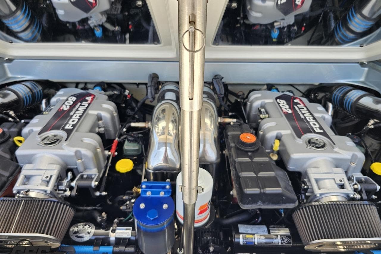 Twin engines of a 2012 Formula 353 FASTech boat, showcasing powerful performance.