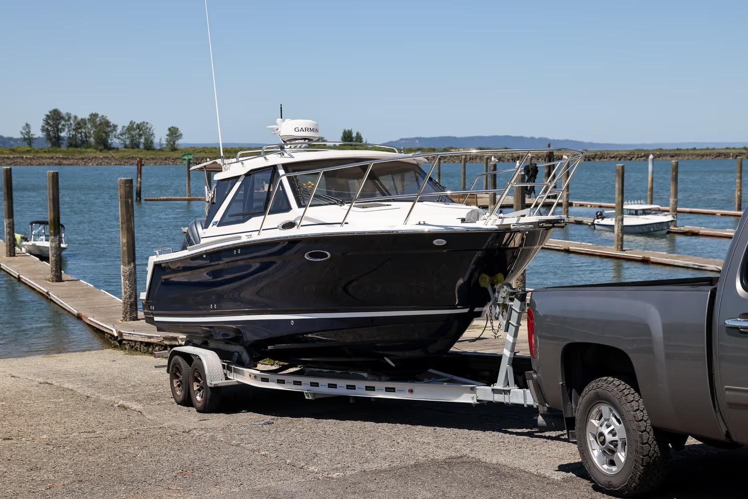 2026 Cutwater C-248 Coupe on trailer by dock, ready for launch.
