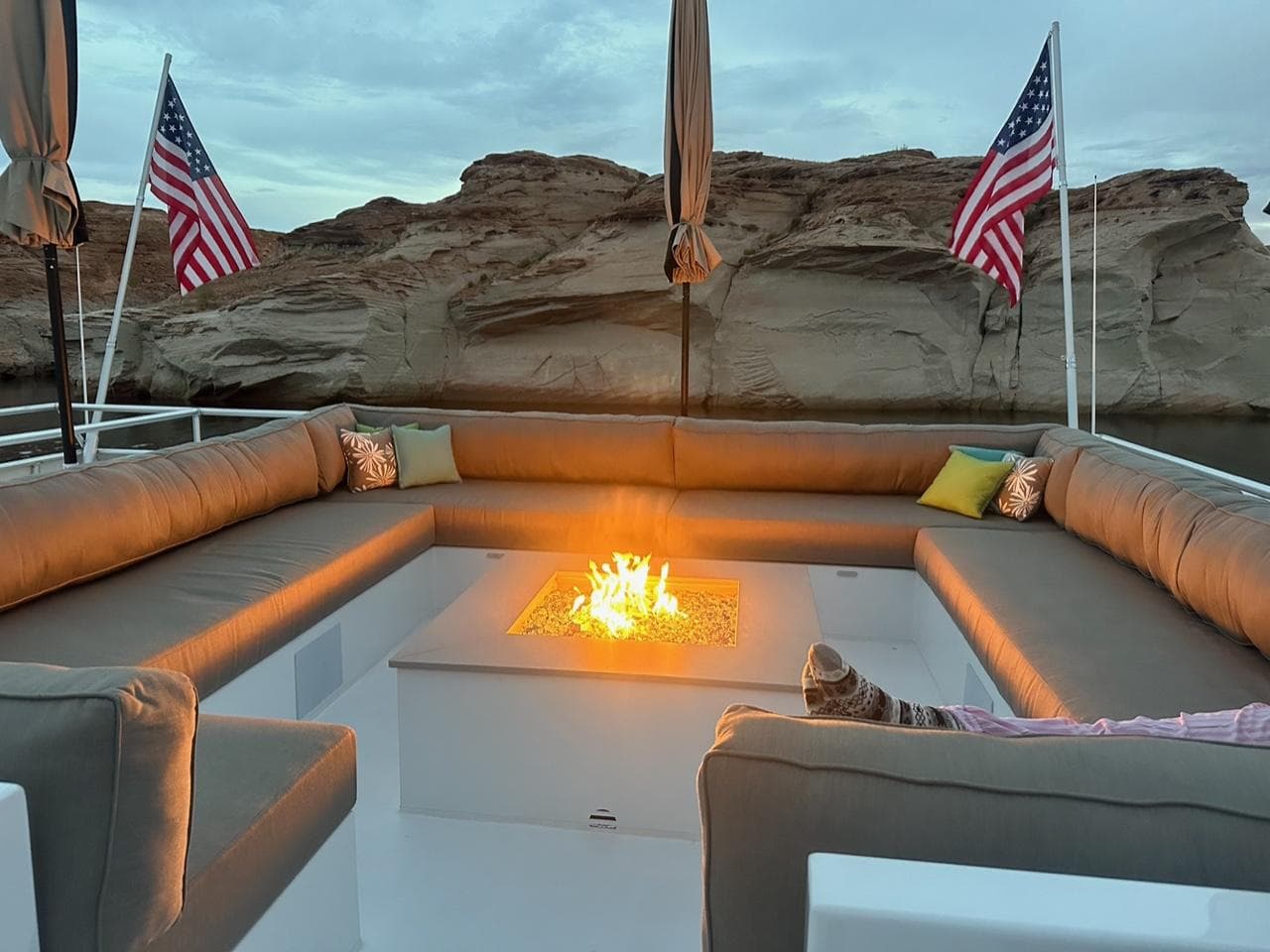 Luxurious Adonia Meticulous Share #7 houseboat with cozy fire pit and American flags, 2023 model.