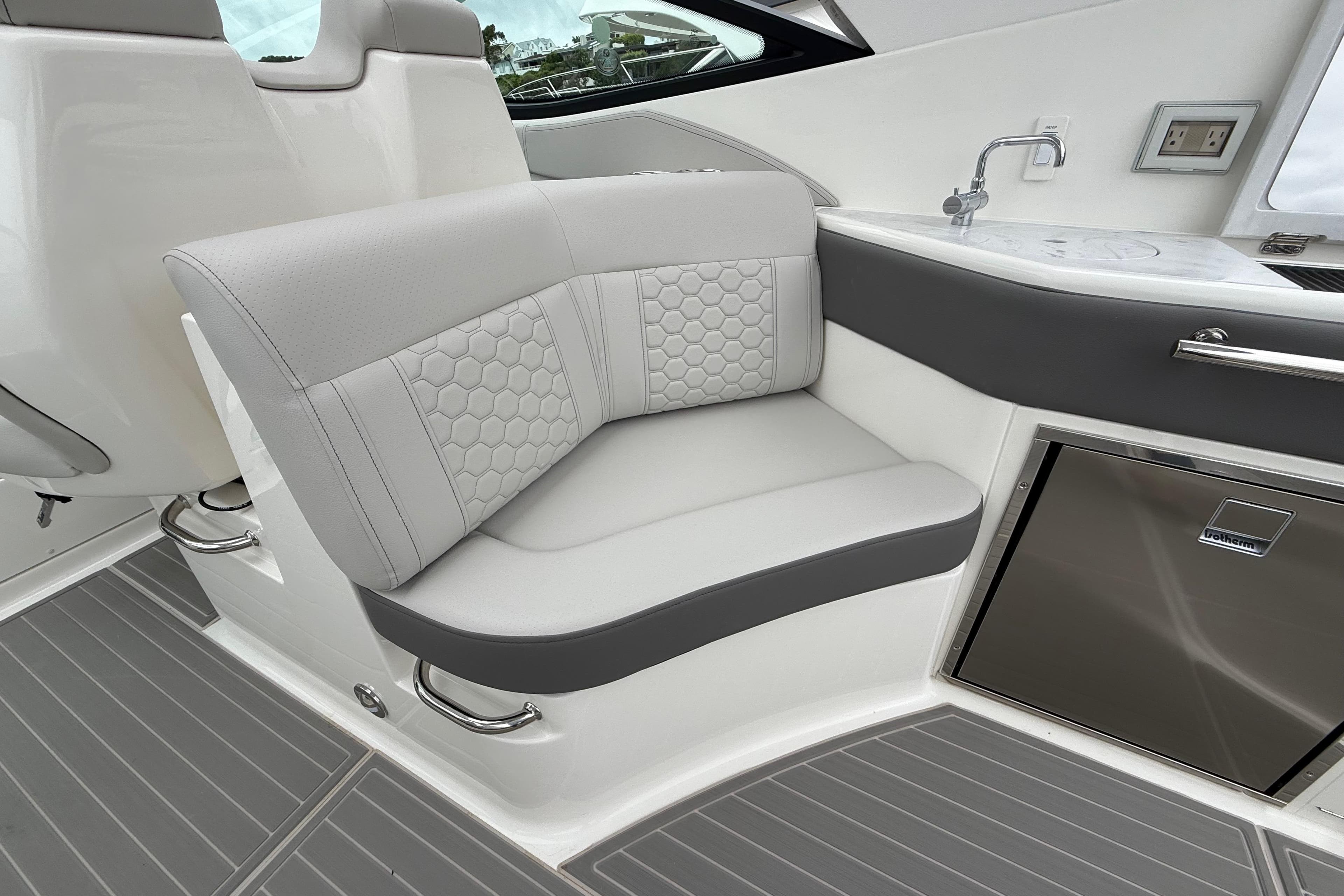 Luxurious seating area on 2026 Sea Ray Sundancer 320 yacht with modern design.