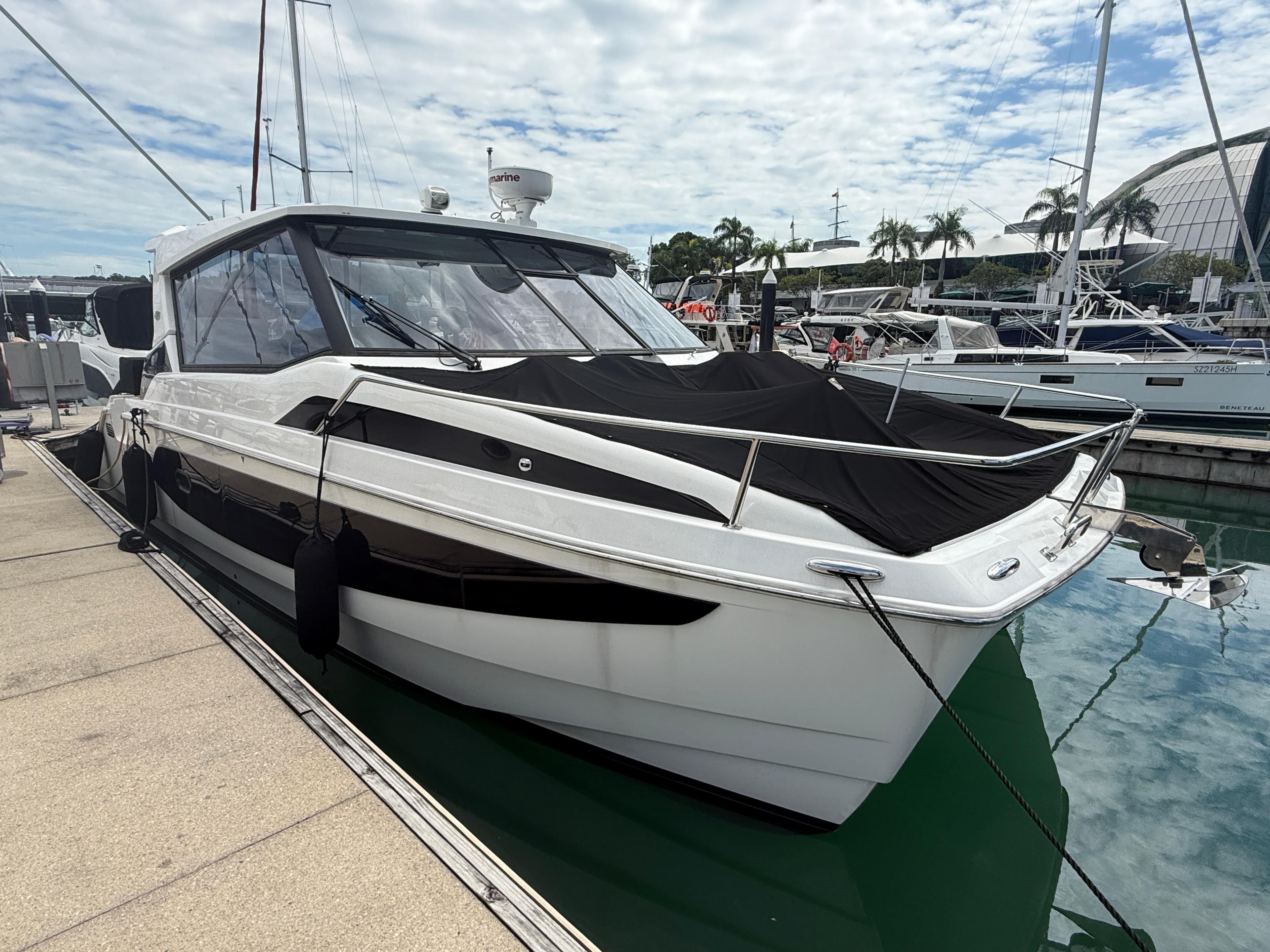 Aquila 36 Sport 2022 yacht docked at marina, featuring sleek design and modern amenities.