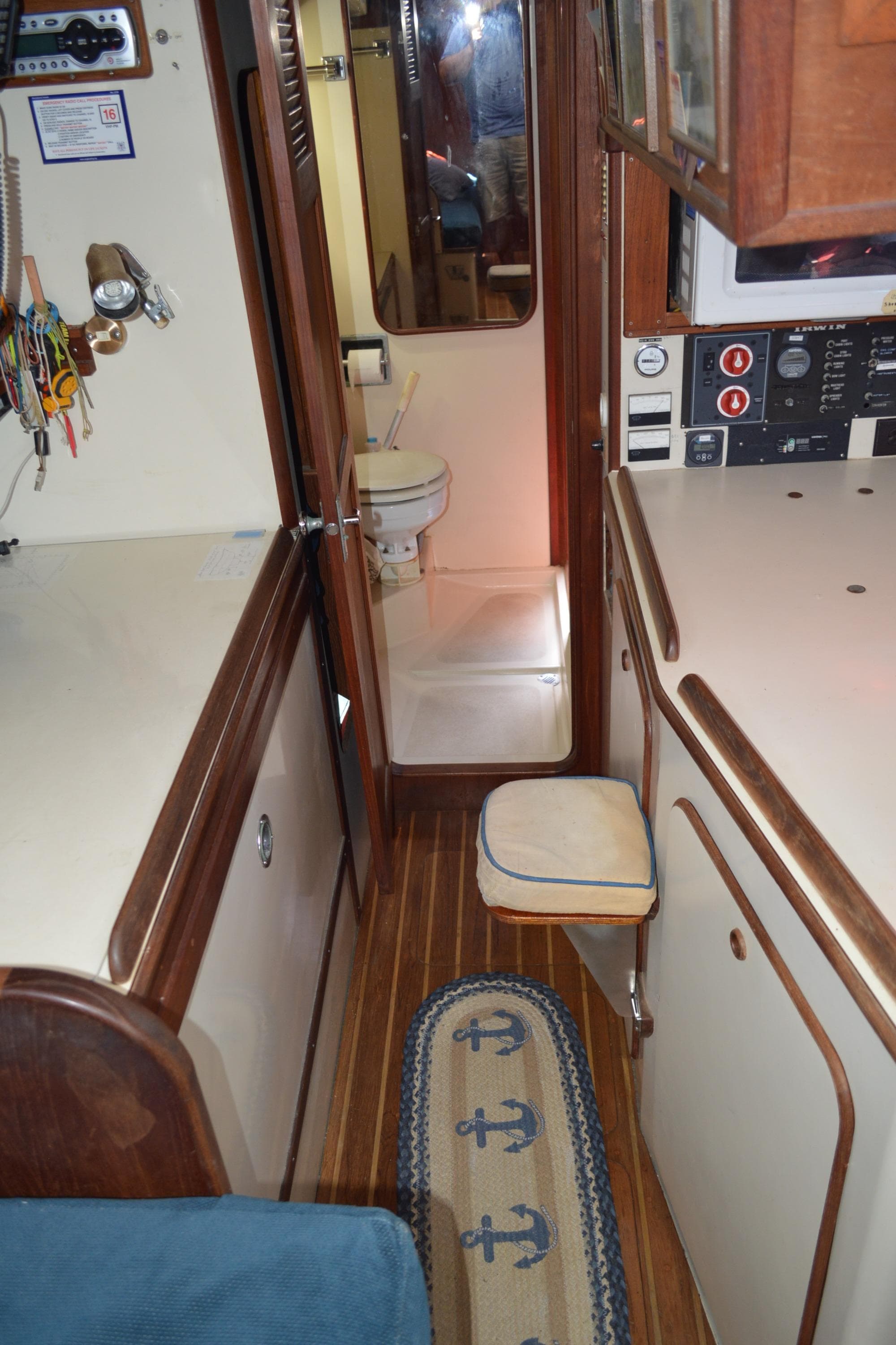 Interior of 1984 Irwin 38 sailboat with wood flooring and compact design.