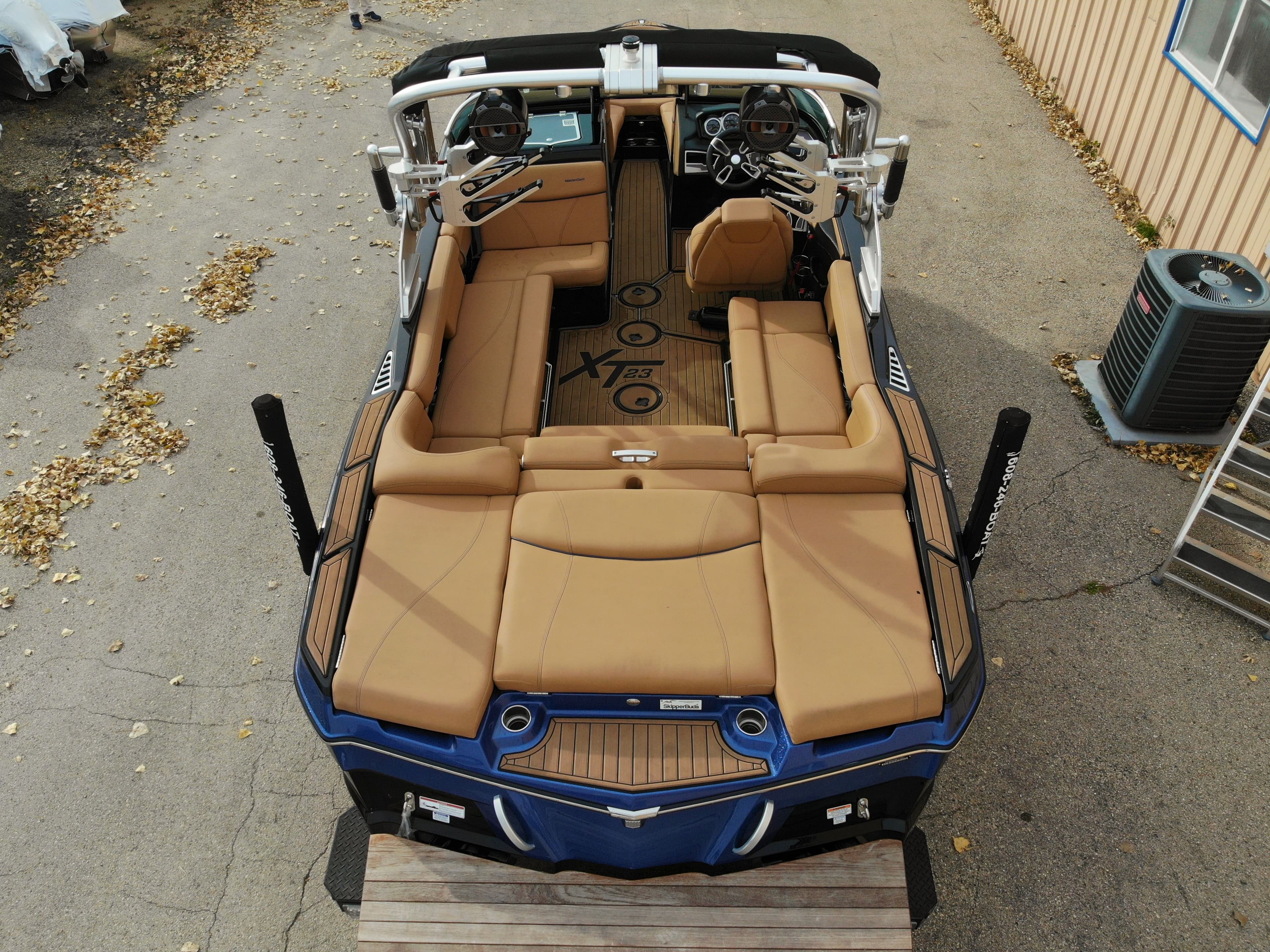 Aerial view of 2021 MasterCraft XT23 boat with brown seating.