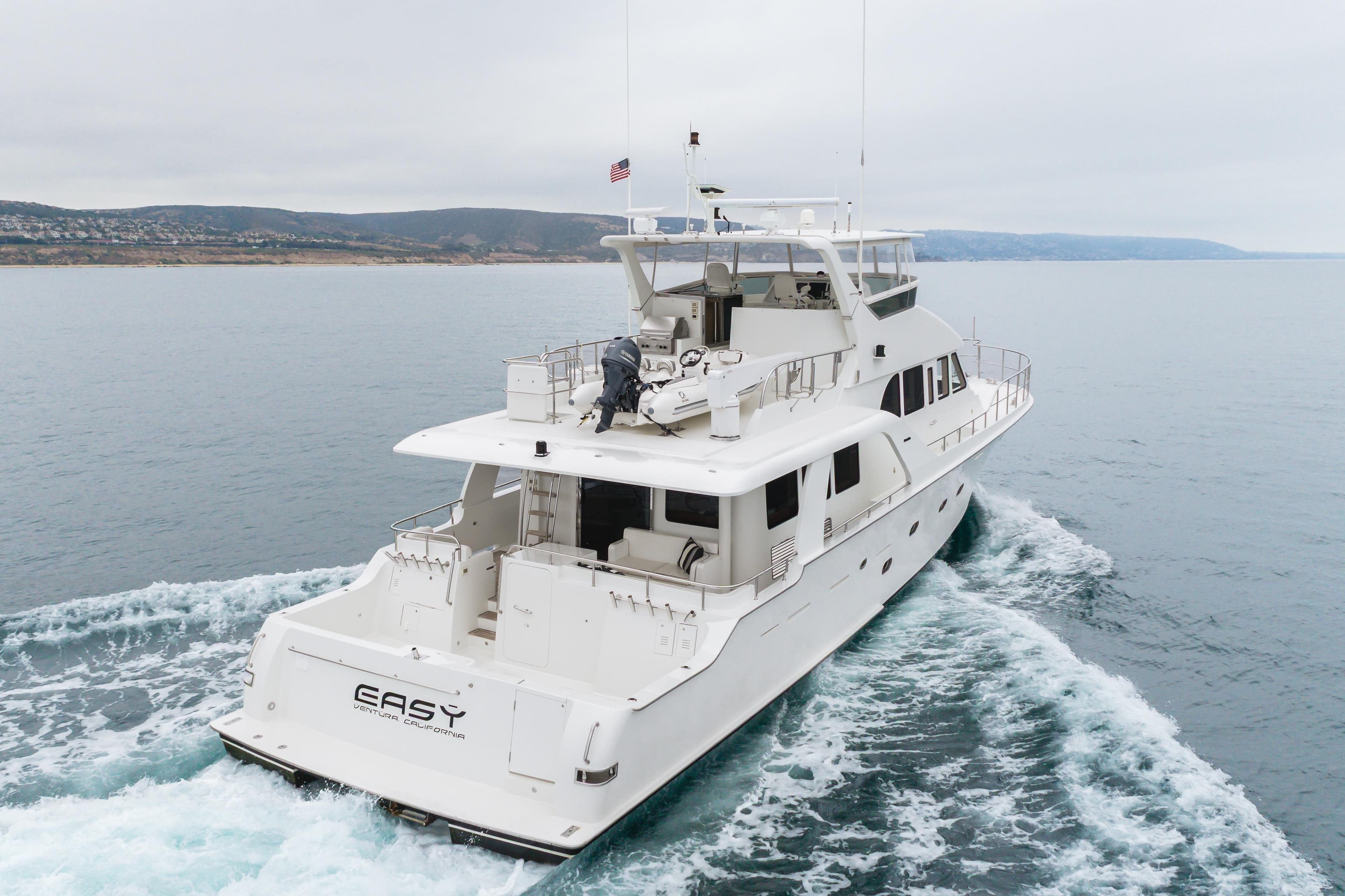 2006 Cheoy Lee 72' Raised Pilot House yacht cruising on open water.