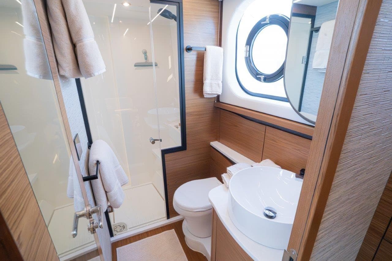 Luxurious bathroom in 2026 Tiara Yachts 56 LS, featuring modern fixtures and elegant design.
