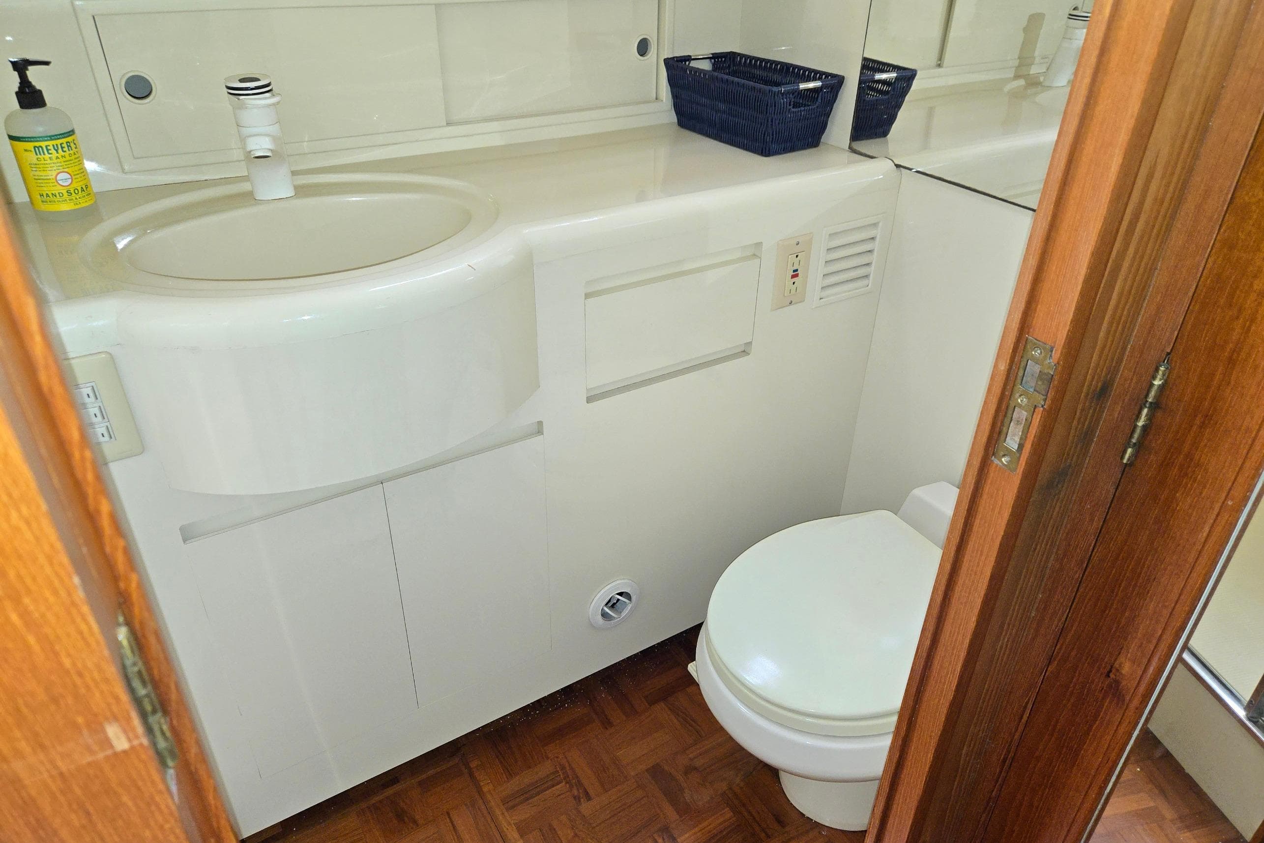 Bathroom interior of 1993 Ocean Alexander 423 Classicco yacht, featuring sink and toilet.
