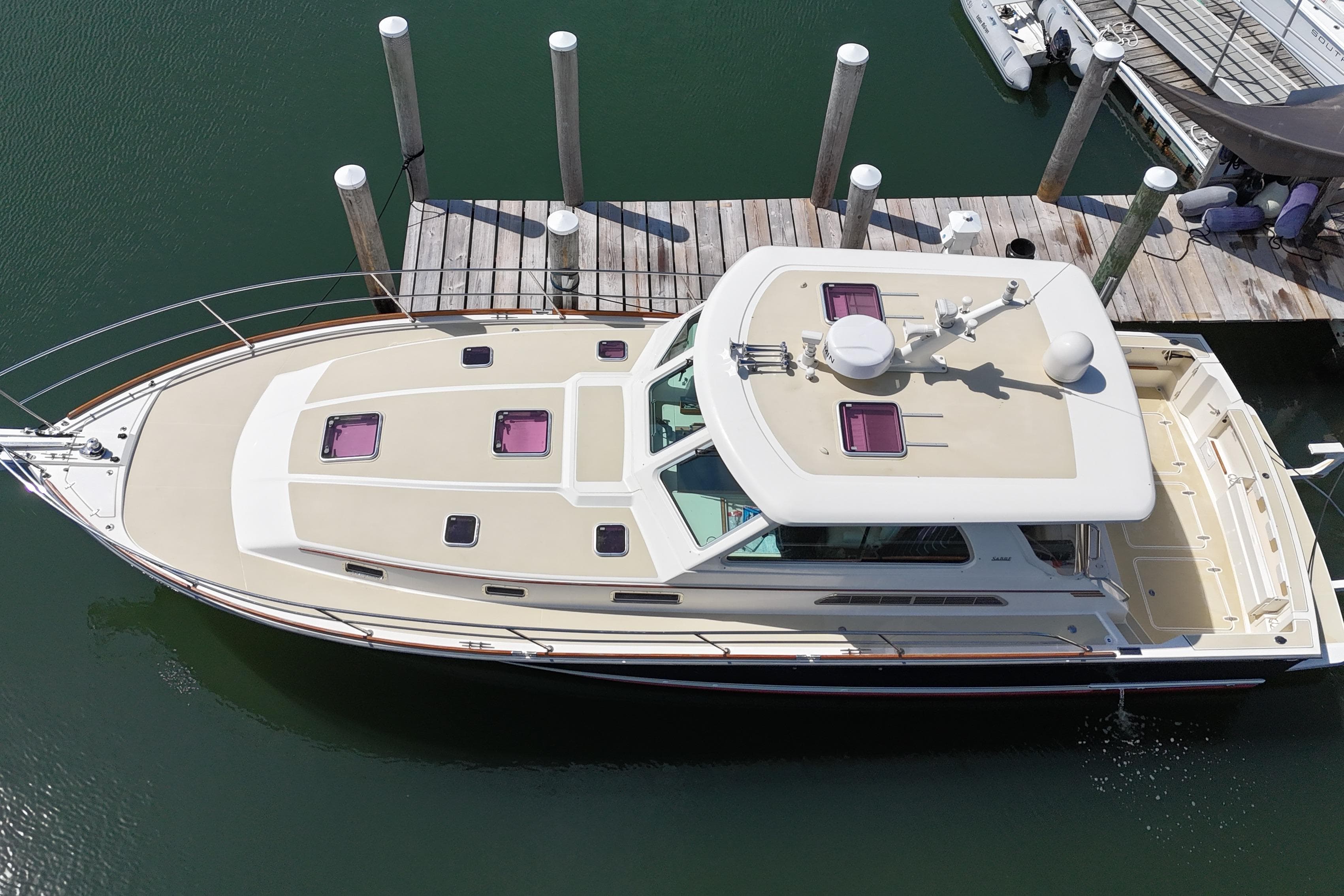 2009 Sabre 42 Express yacht docked at marina, aerial view.