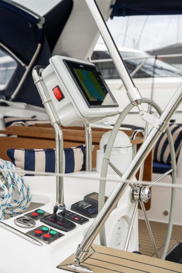 Cockpit of 2019 Southerly 480 yacht with navigation equipment and striped cushions.