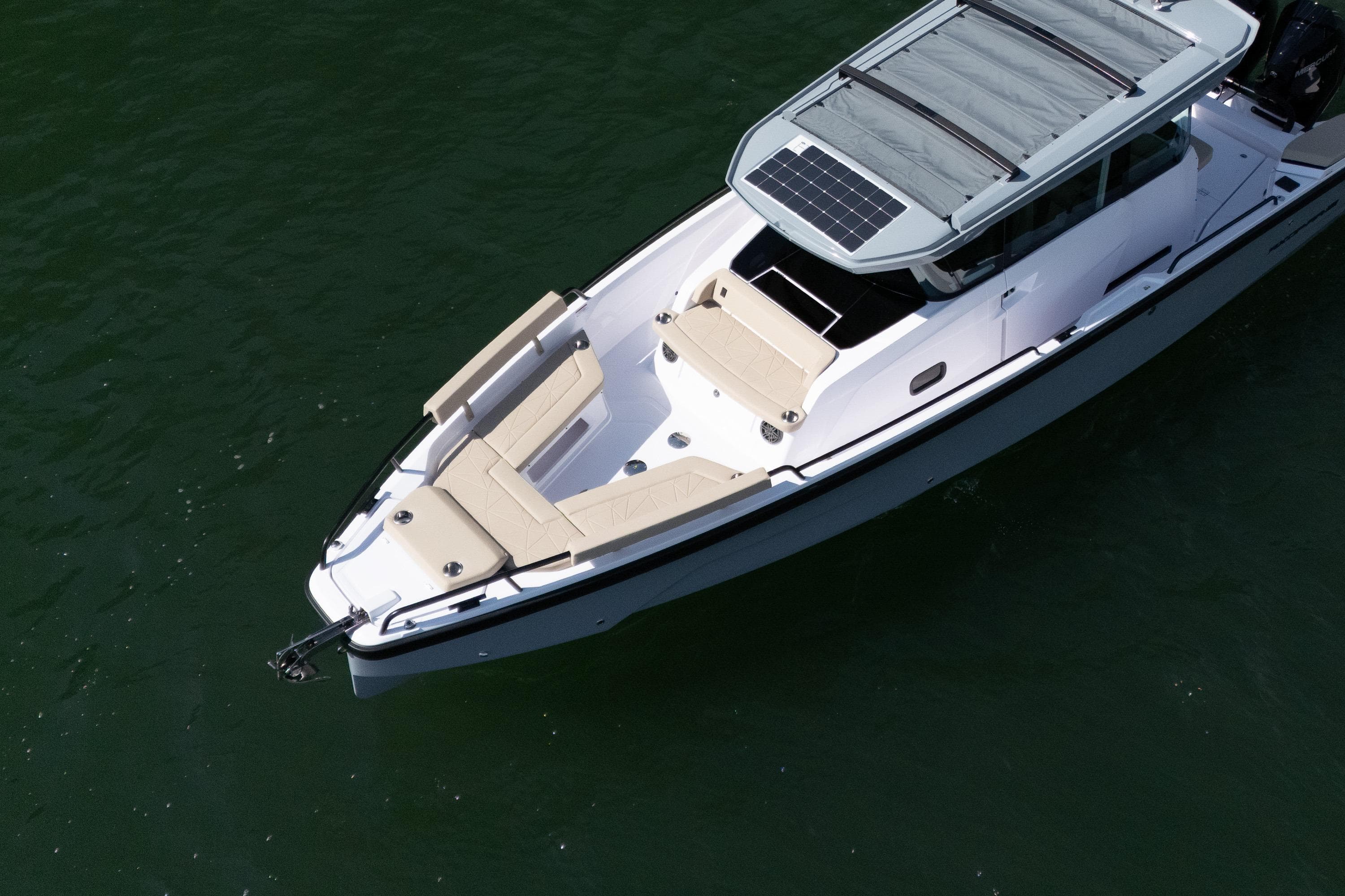 2026 Axopar 29 XC Cross Cabin boat with solar panel, cruising on water.