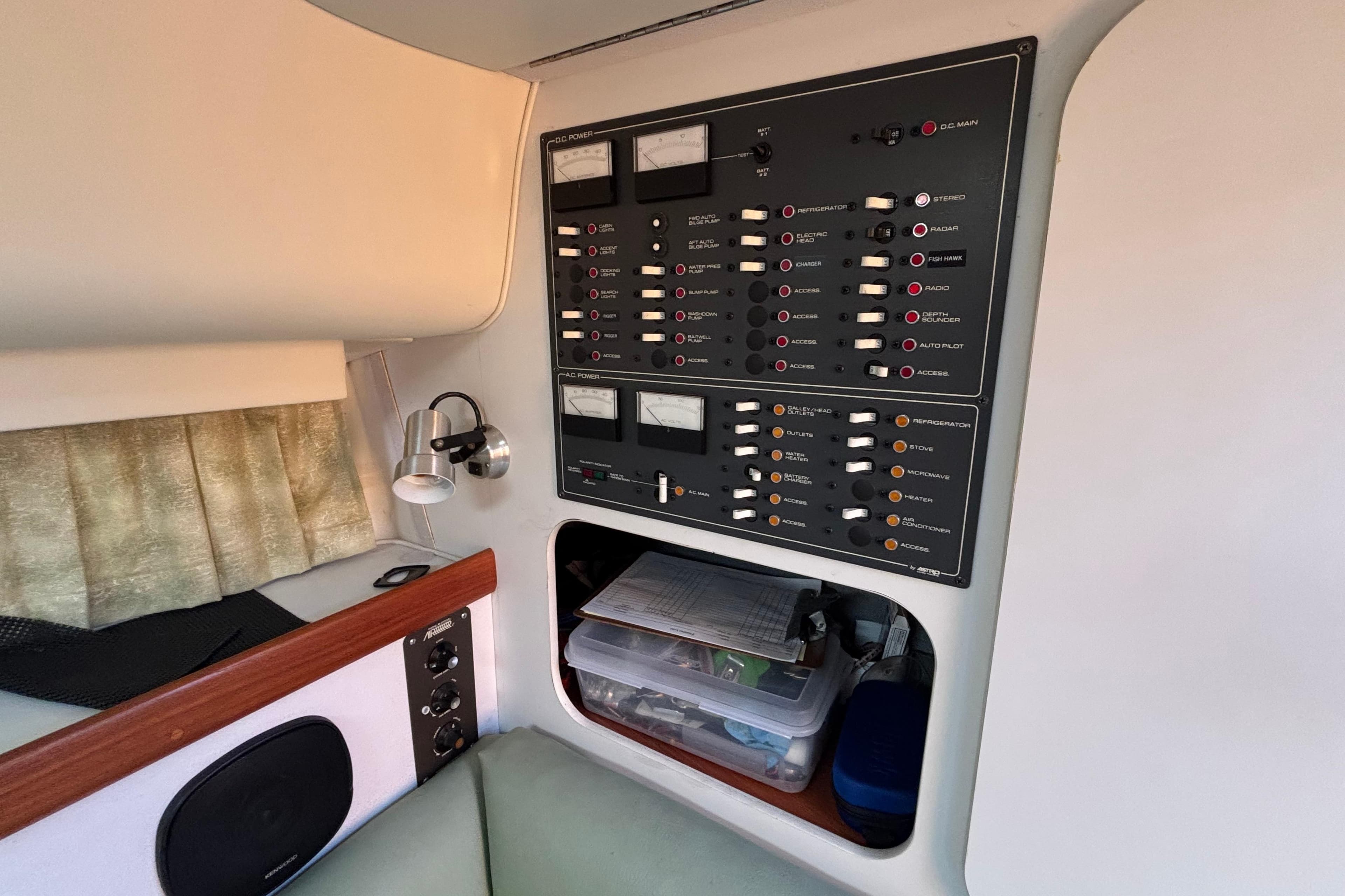 Control panel inside a 1991 Tiara Yachts 3100 Open, featuring switches and meters.