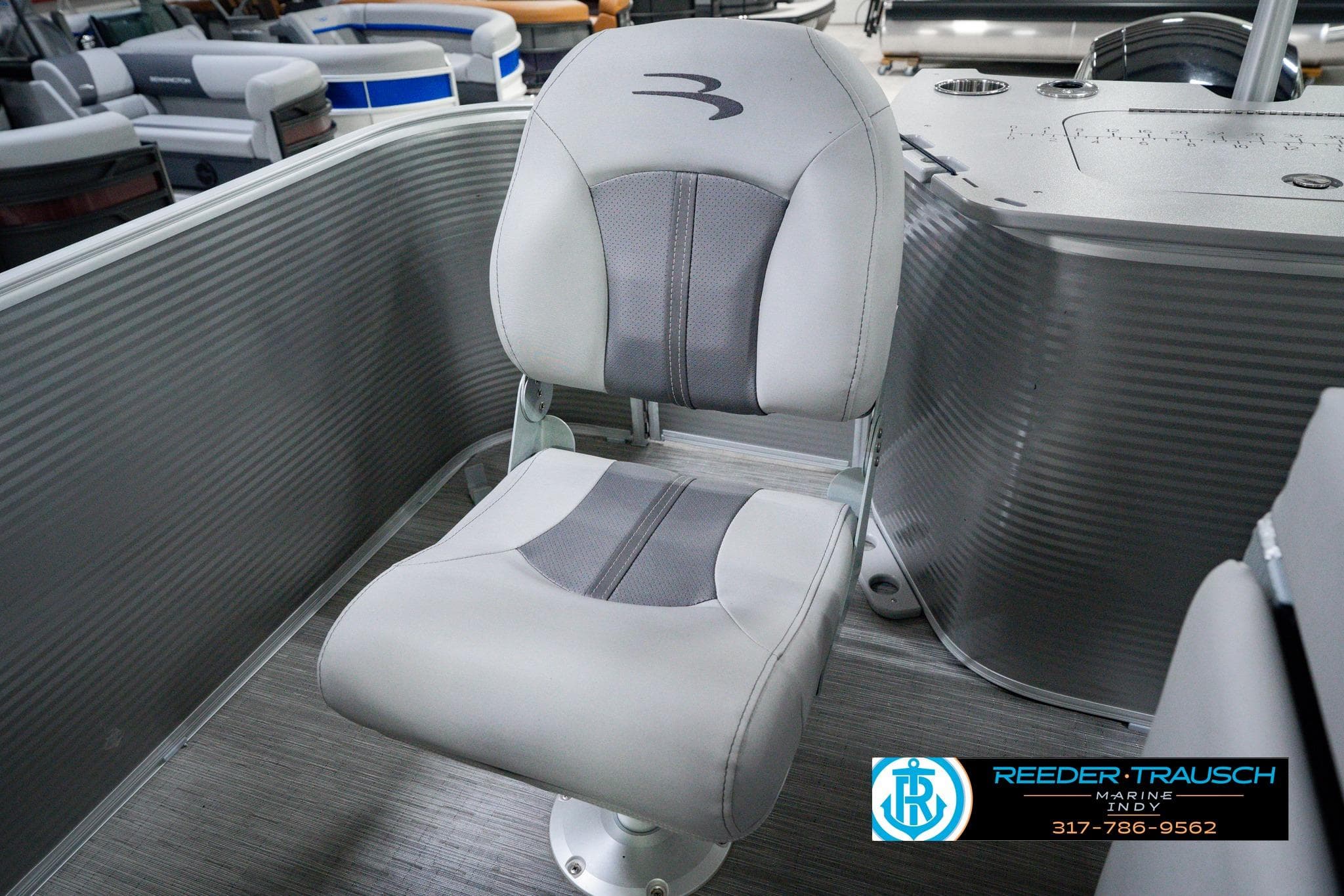 2026 Bennington 22 SXSAPG boat seat with gray upholstery and logo detail.