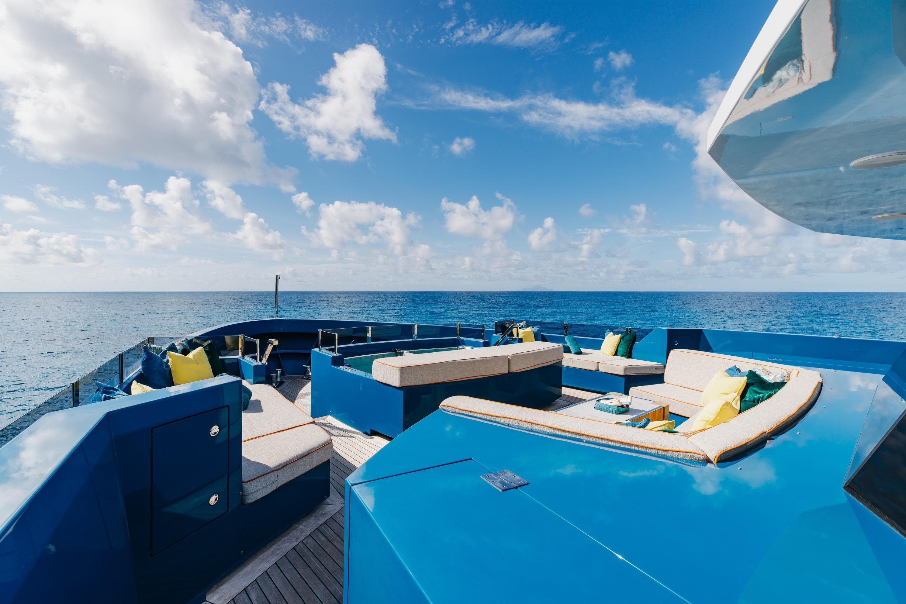 Luxurious 2024 Dunya Yachts Explorer deck with ocean view and plush seating.