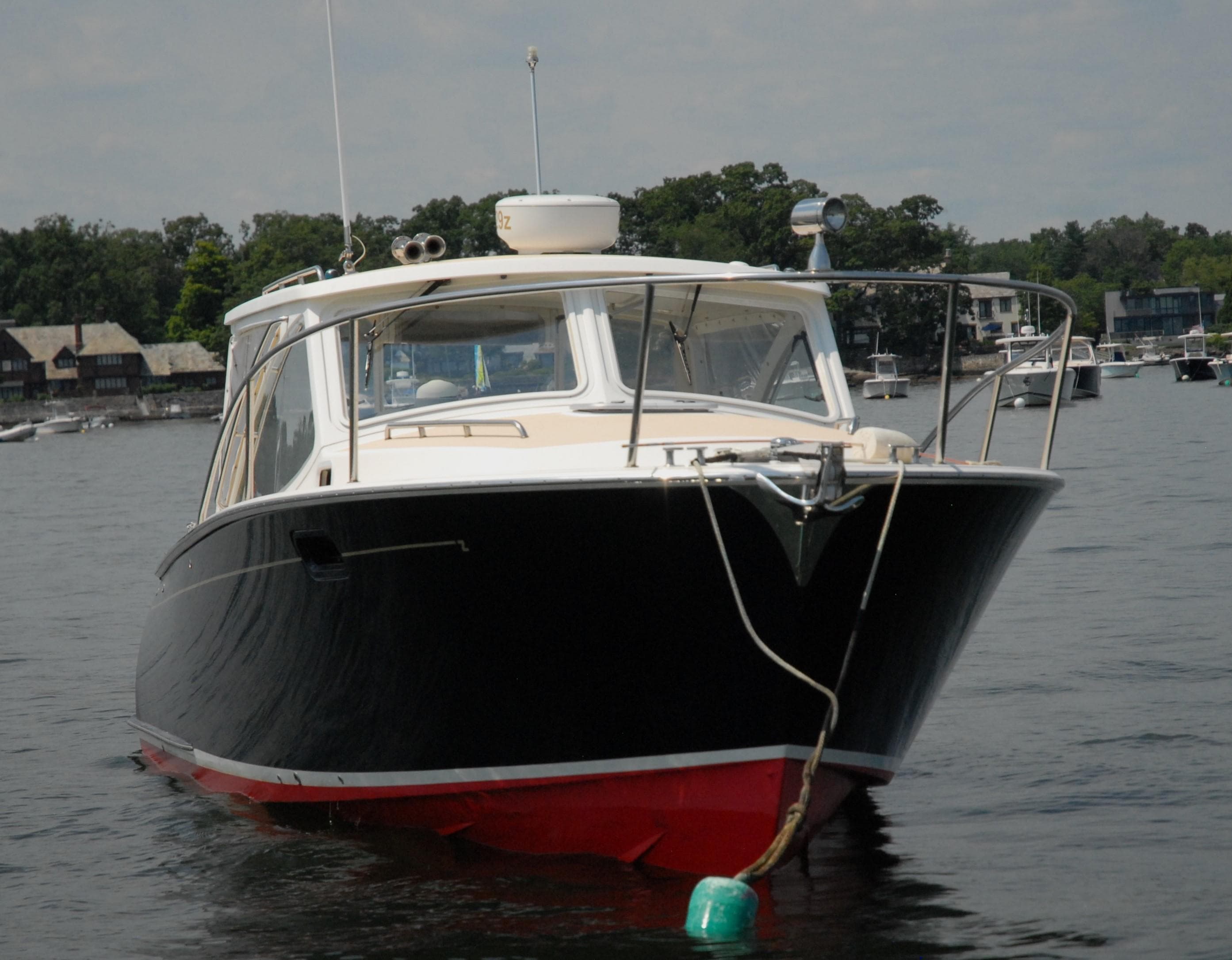 2007 MJM 29z boat anchored in a calm lake.