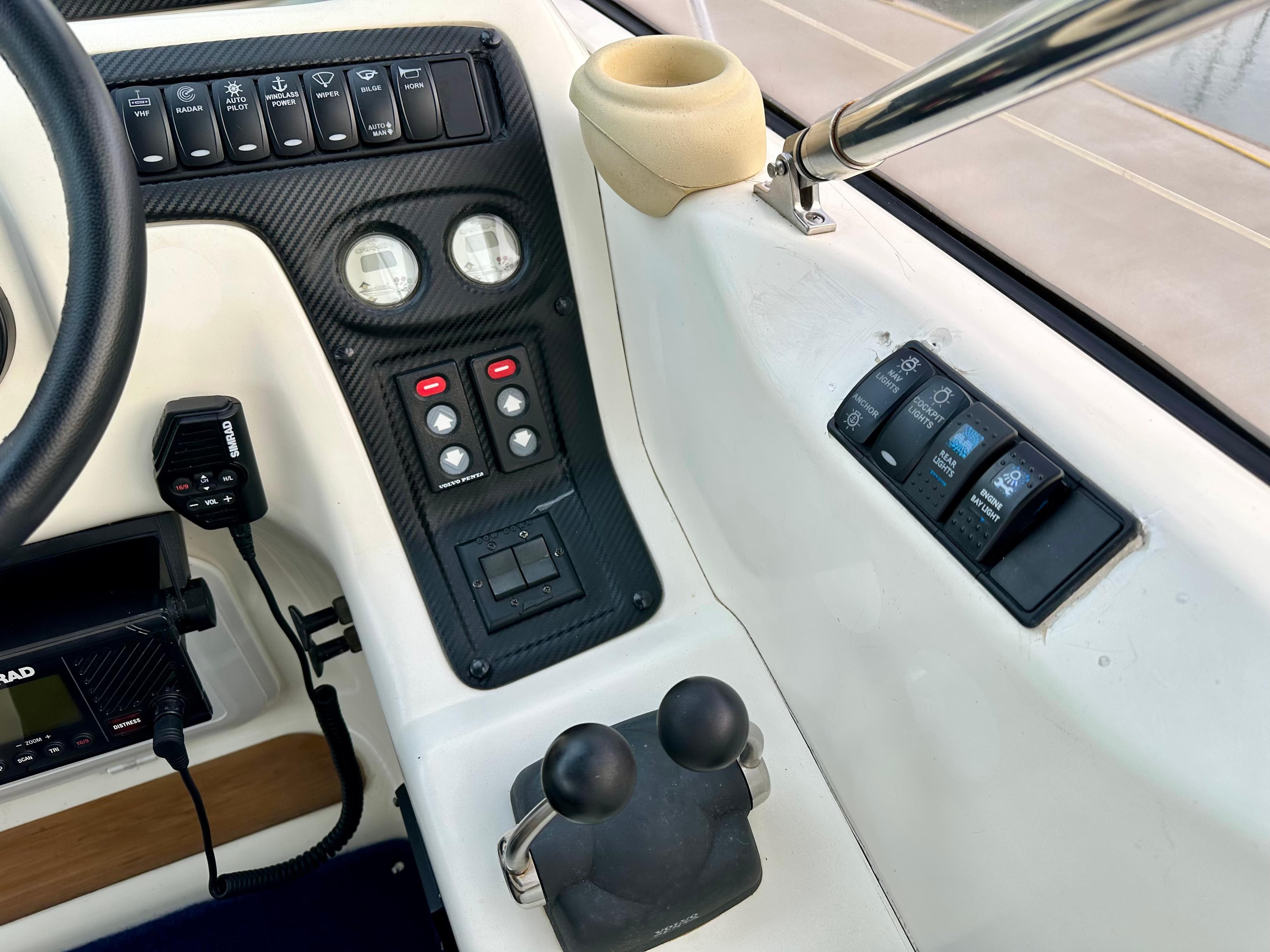 Control panel of a 1999 Cranchi Endurance 39 boat with gauges and switches.